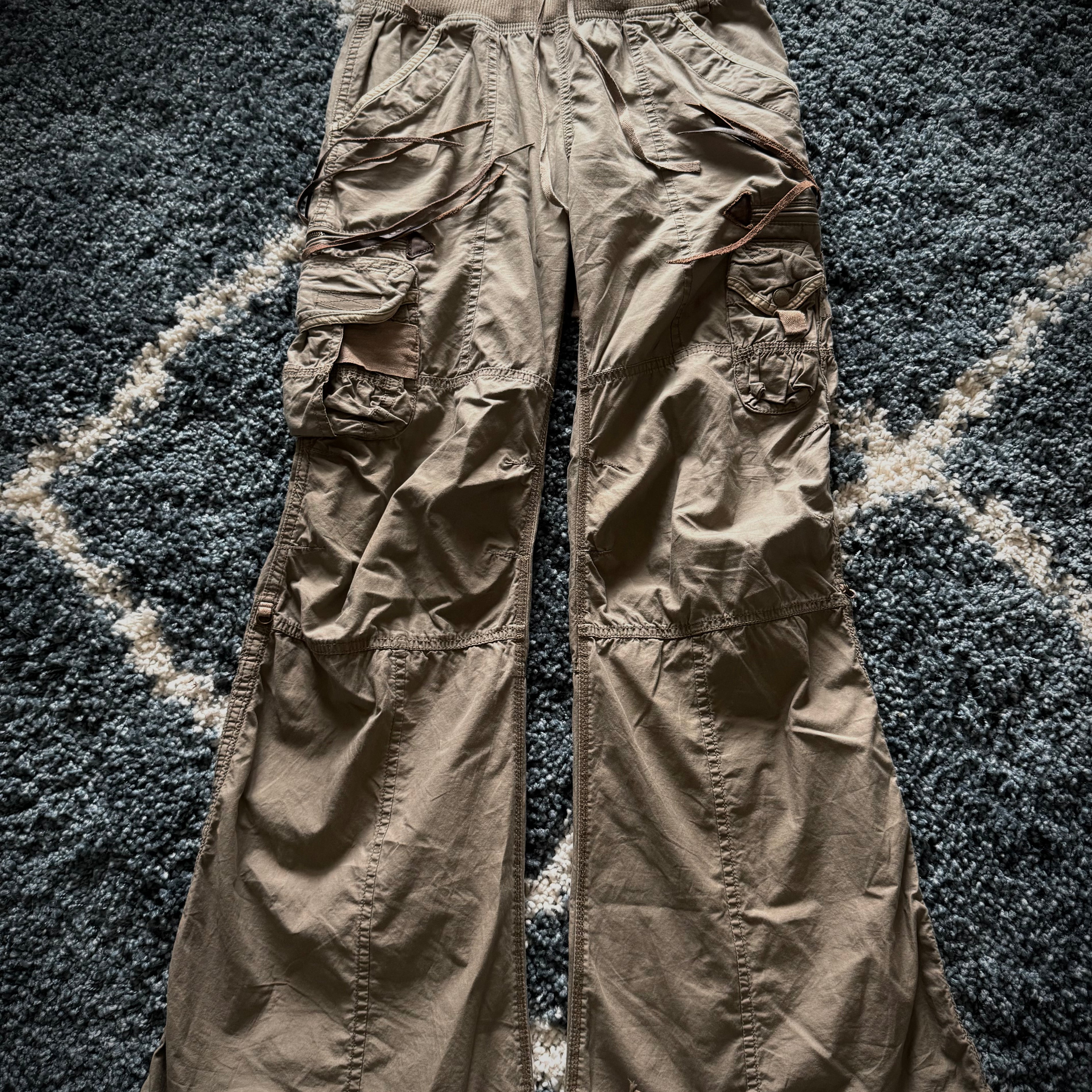 G.O.A leather tasseled mega flared military cargo pants