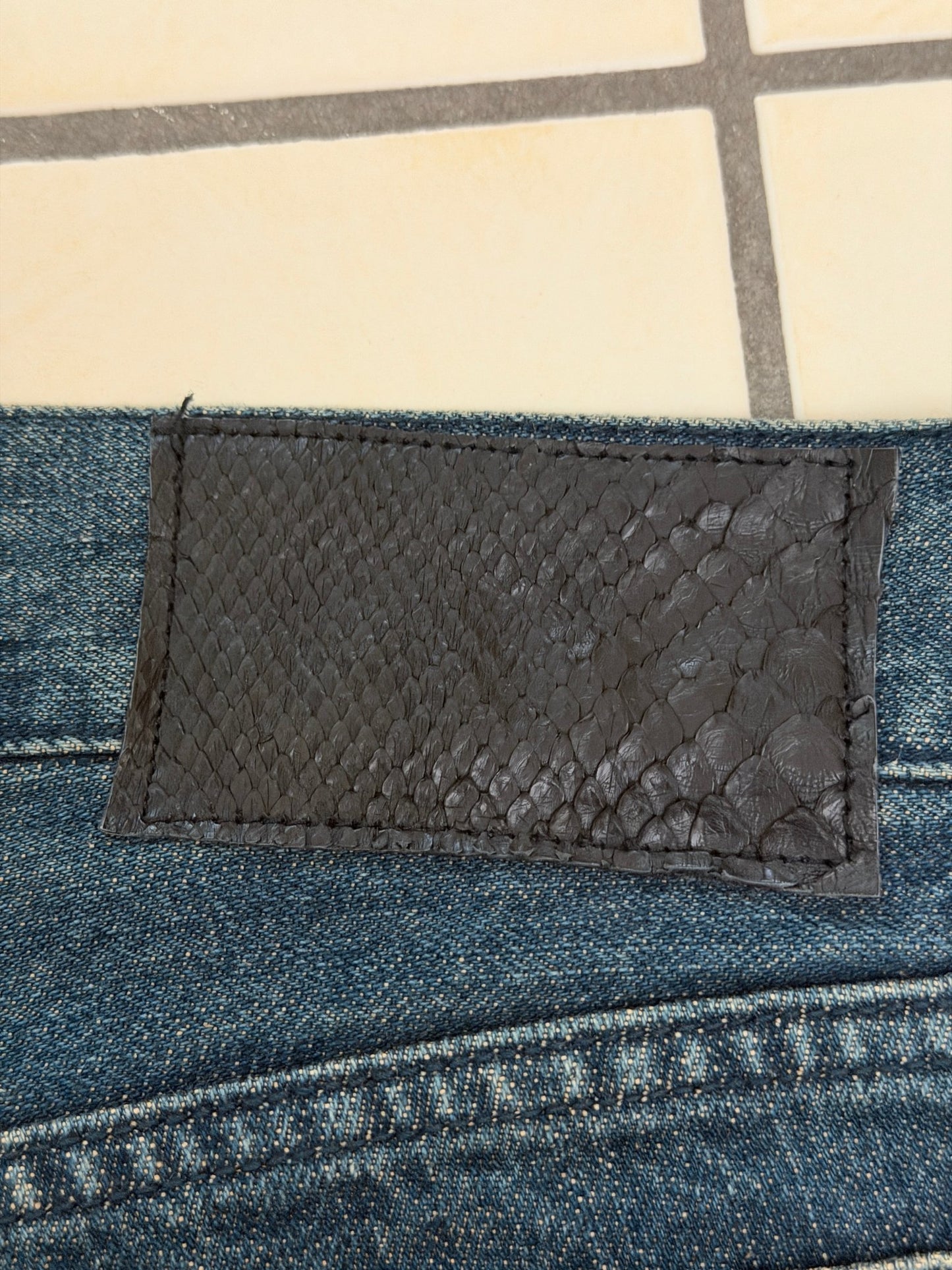 5351 Pour Les Hommes Distressed Python Flared Denim Pants - wintexarchive