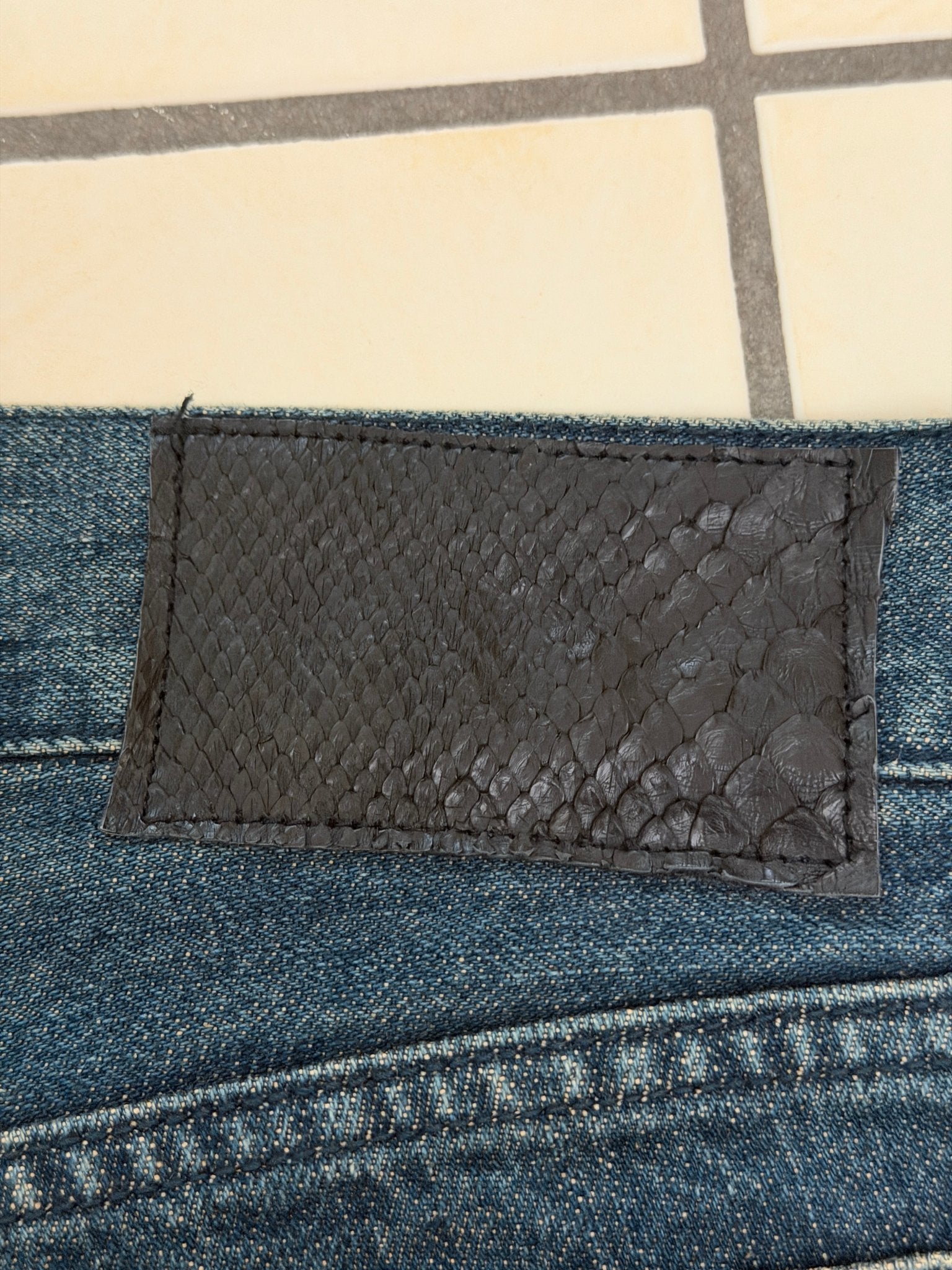 5351 Pour Les Hommes Distressed Python Flared Denim Pants - wintexarchive