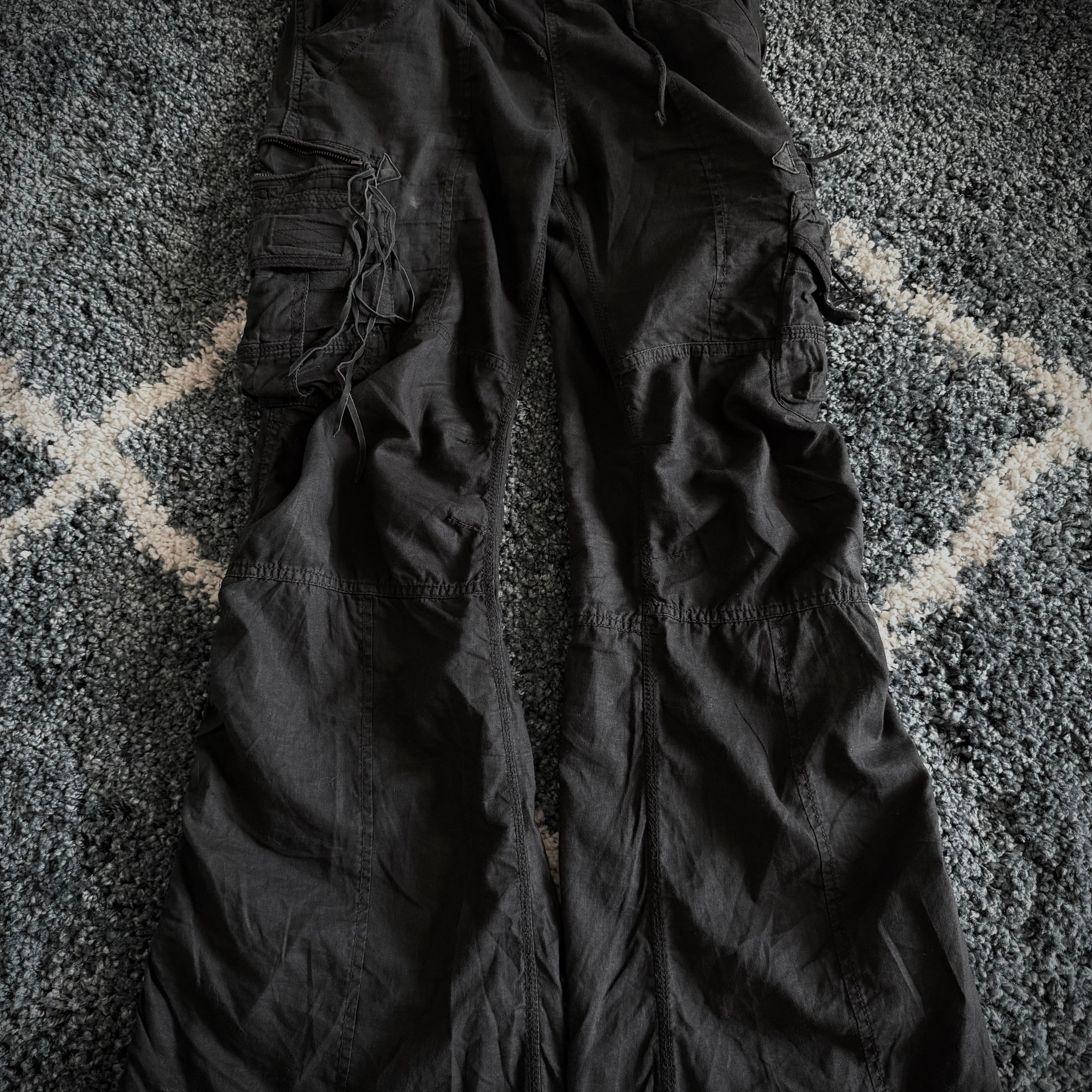 G.O.A Black Leather Tasseled Flared Cargo Pants