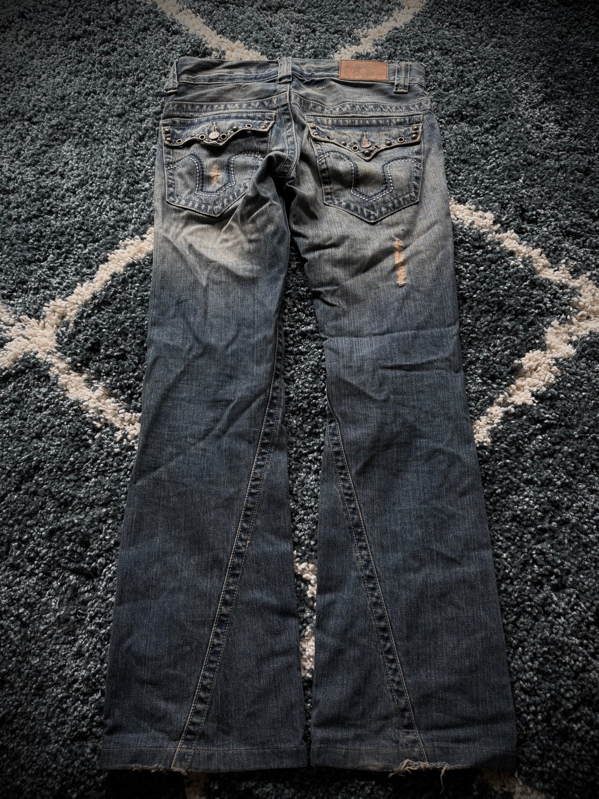 Tornado Mart spiral studded distressed flared jeans
