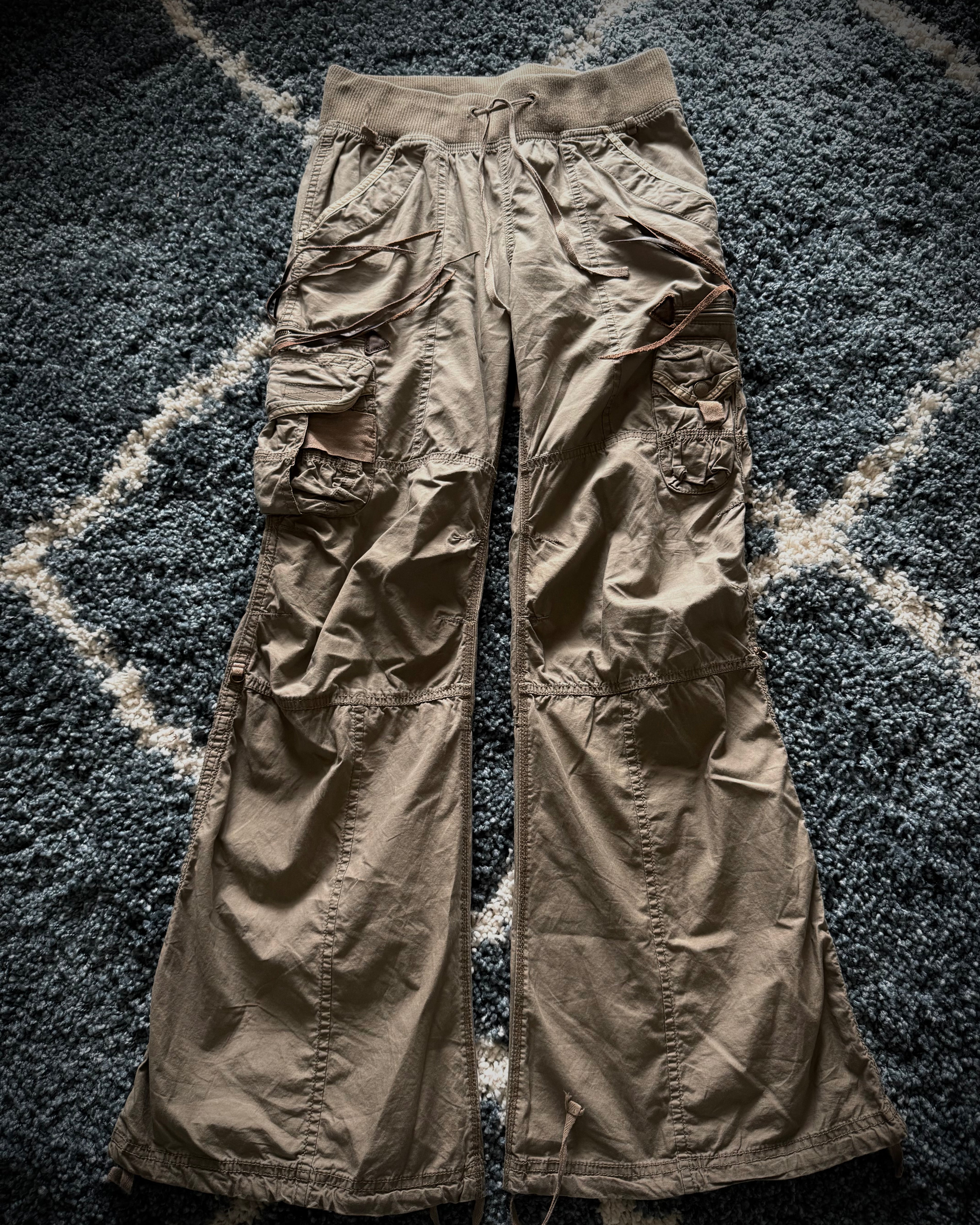 G.O.A leather tasseled mega flared military cargo pants