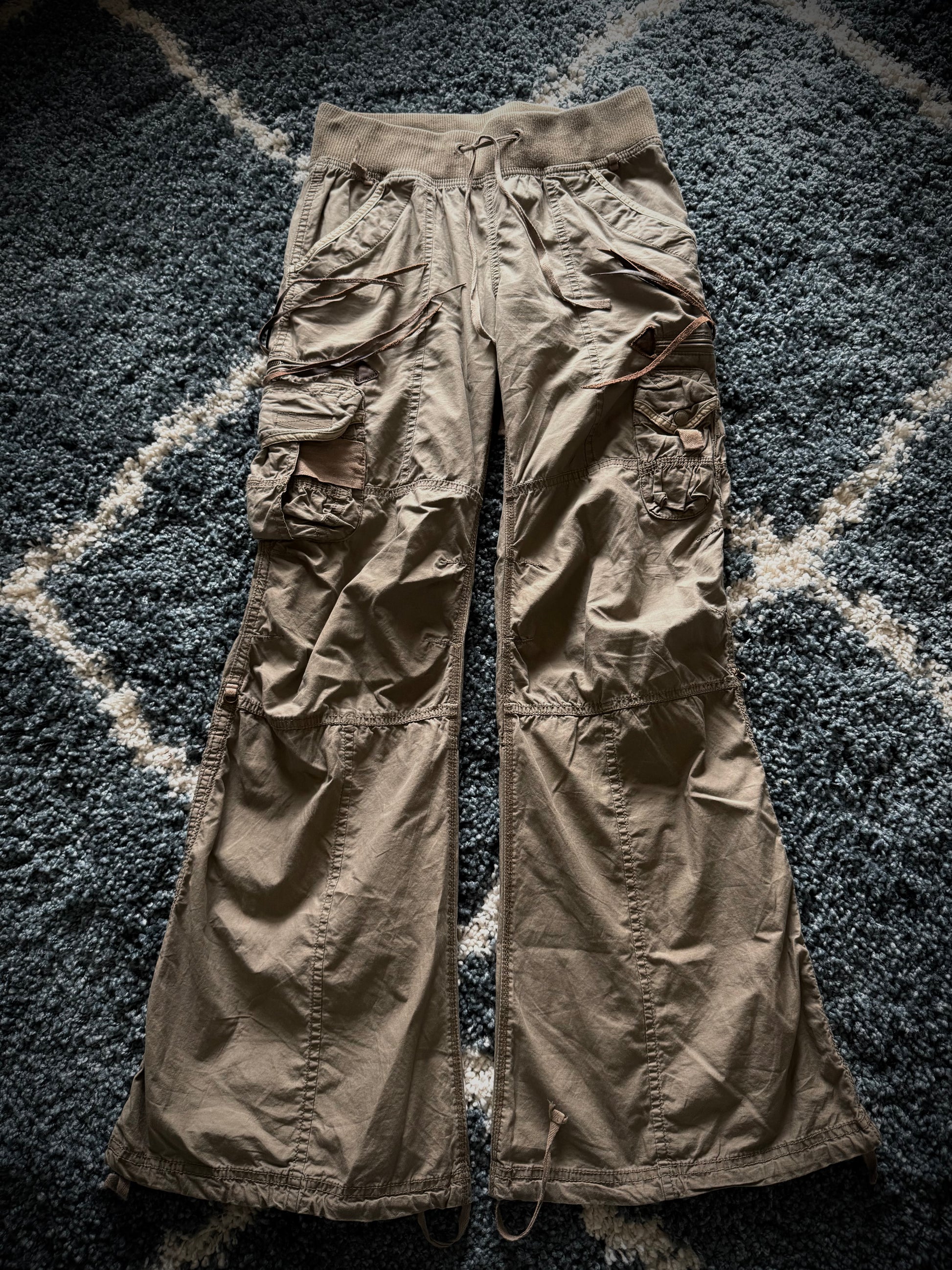 G.O.A leather tasseled mega flared military cargo pants