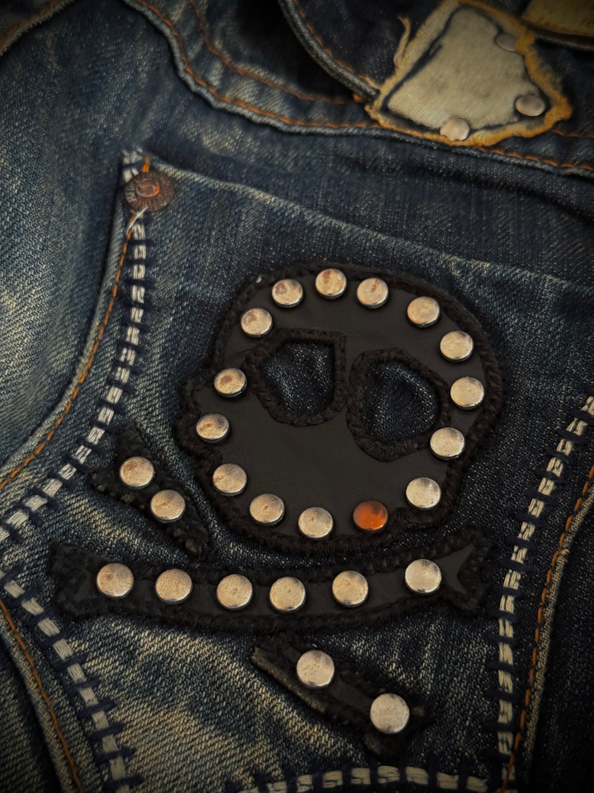Red Pepper Mud Washed studded skull flared denim