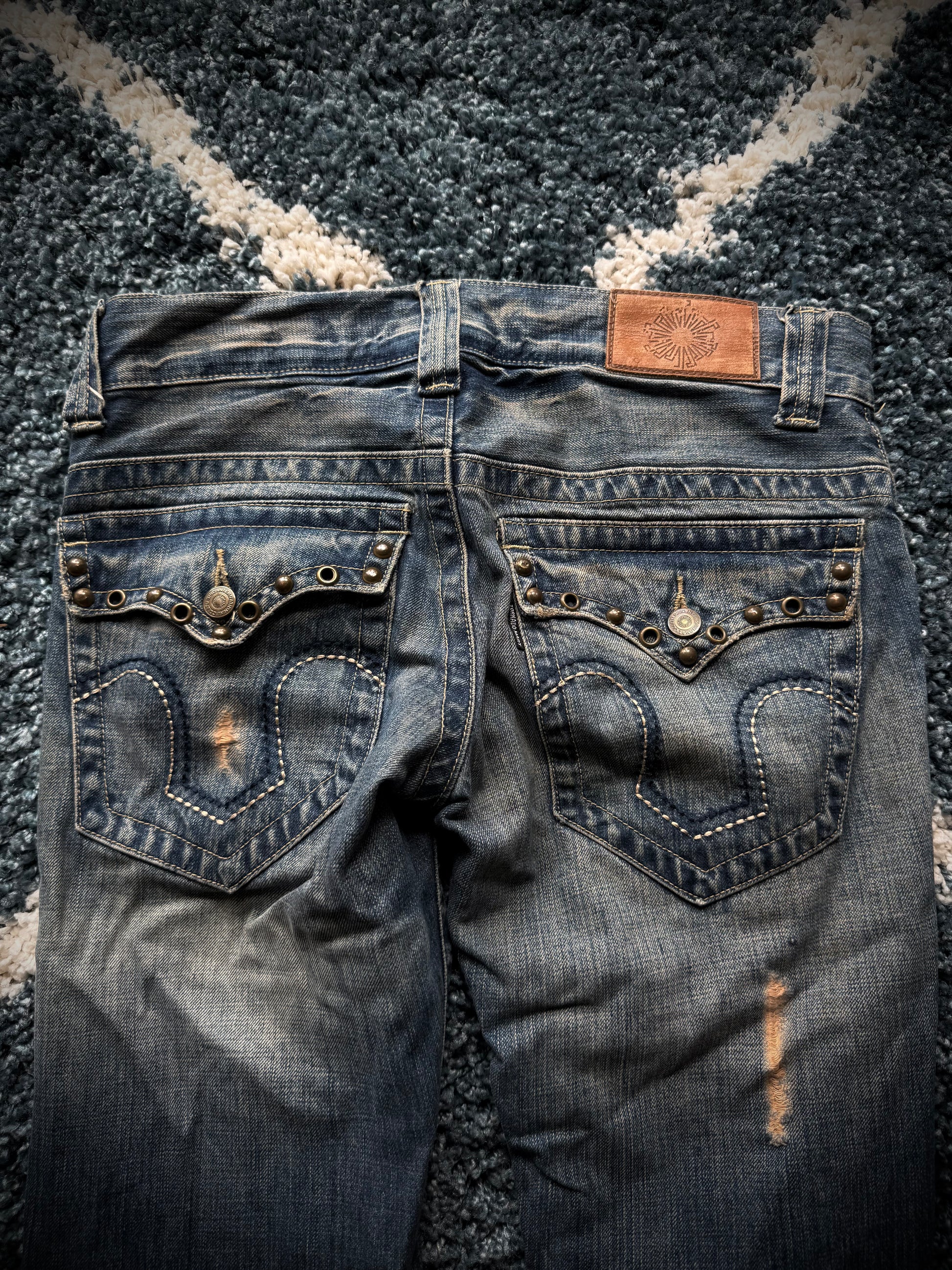 Tornado Mart spiral studded distressed flared jeans