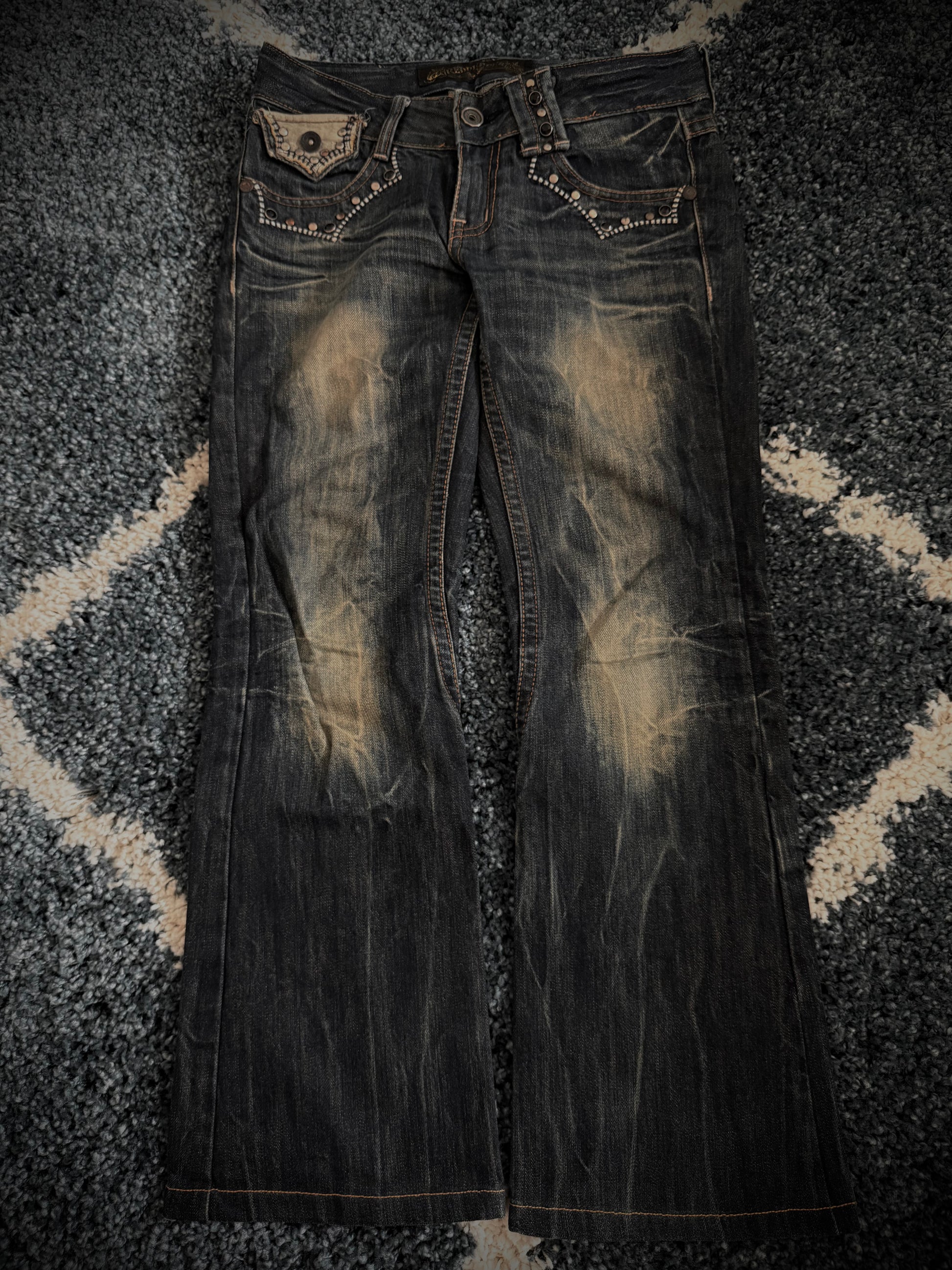 Red Pepper Mud Washed studded skull flared denim