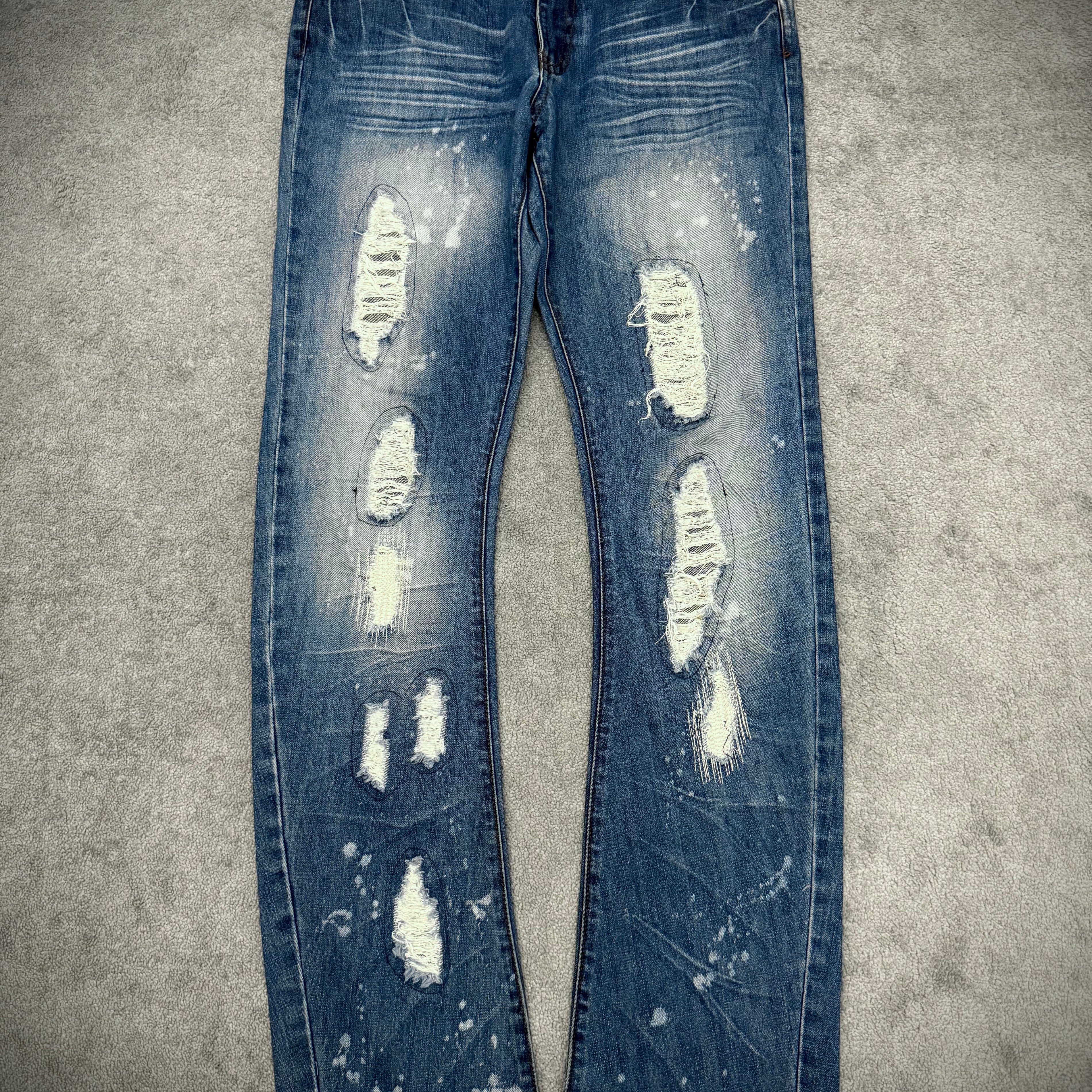 Schlussel distressed banana cut splatterd pants