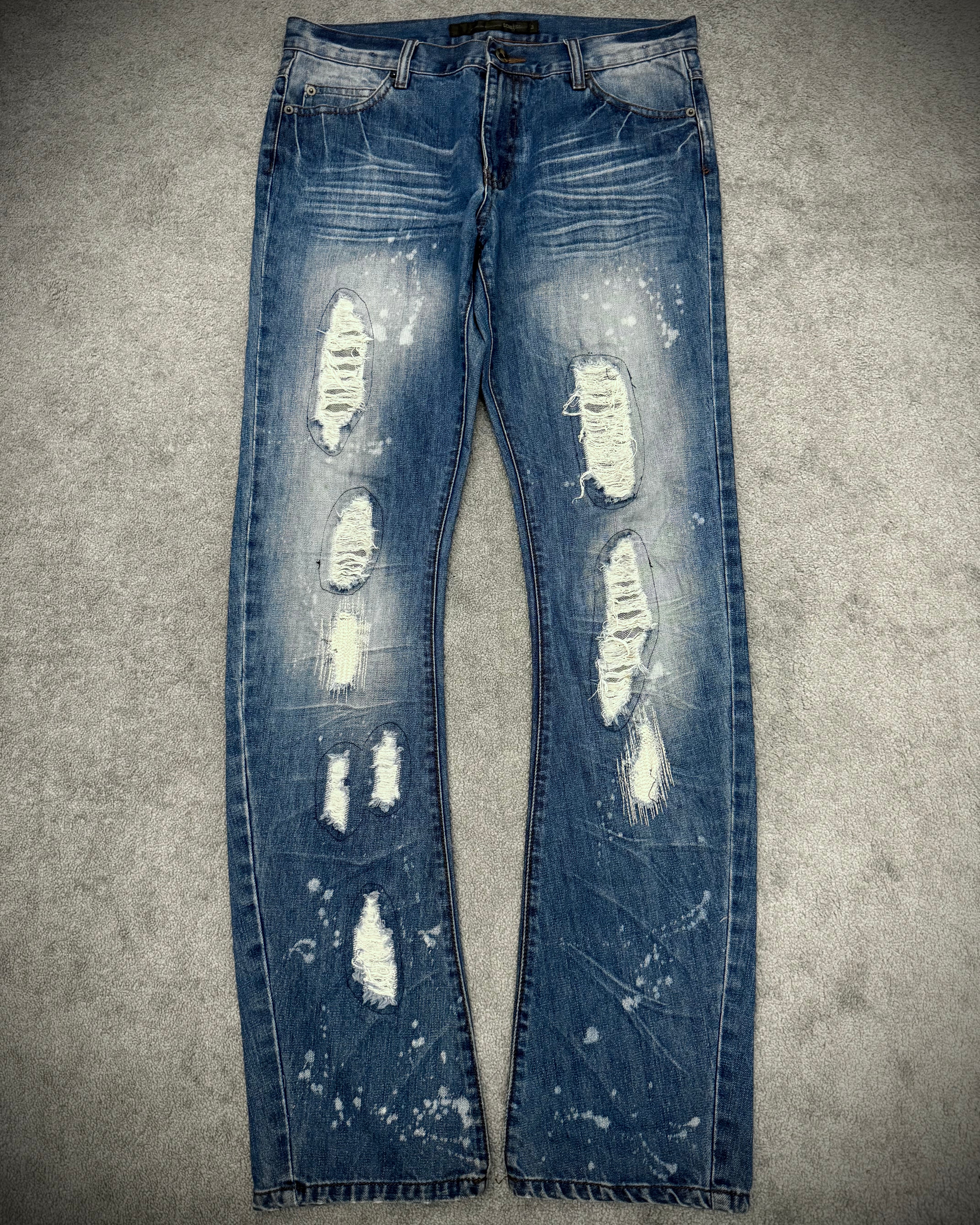 Schlussel distressed banana cut splatterd pants
