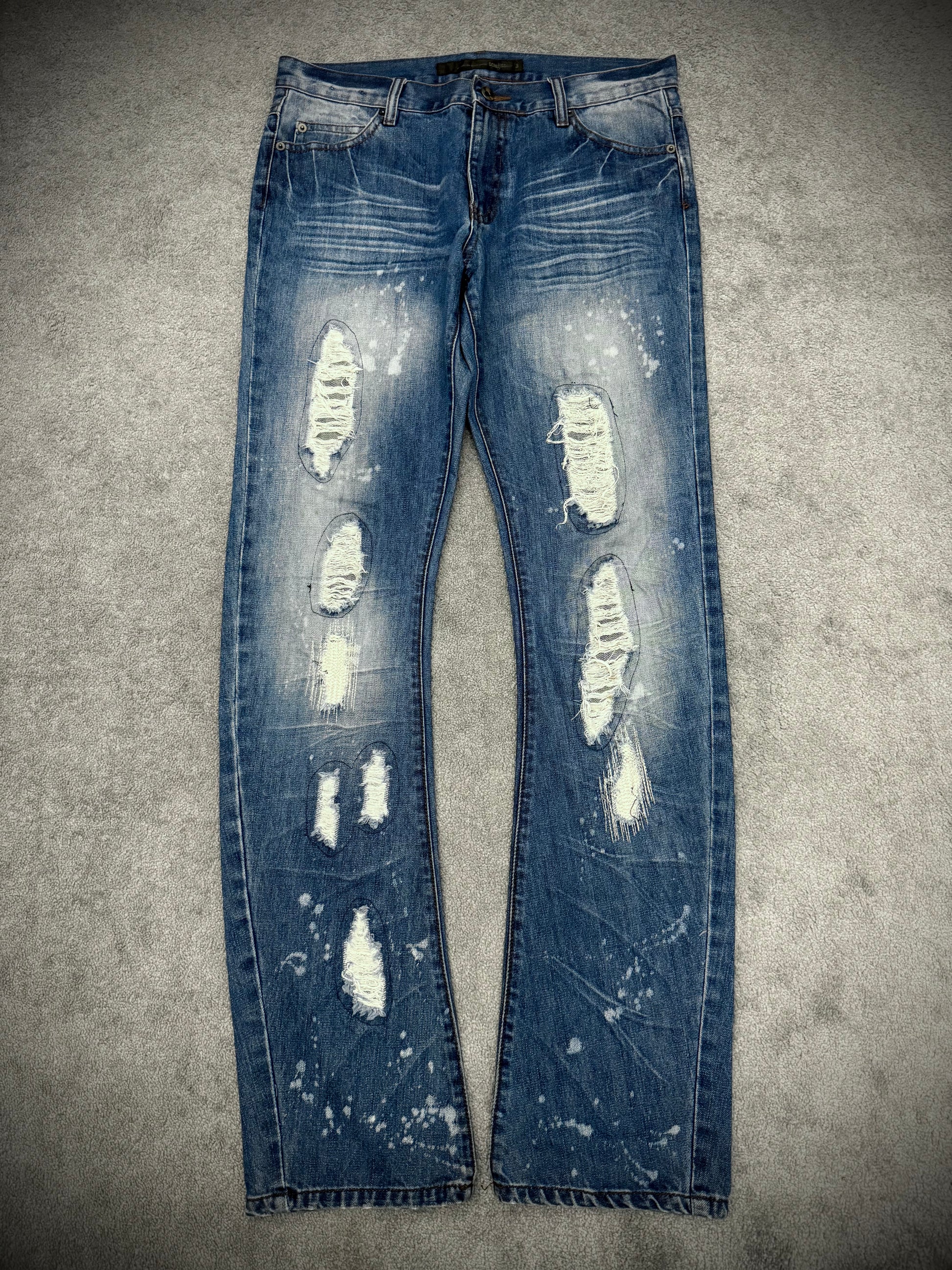 Schlussel distressed banana cut splatterd pants