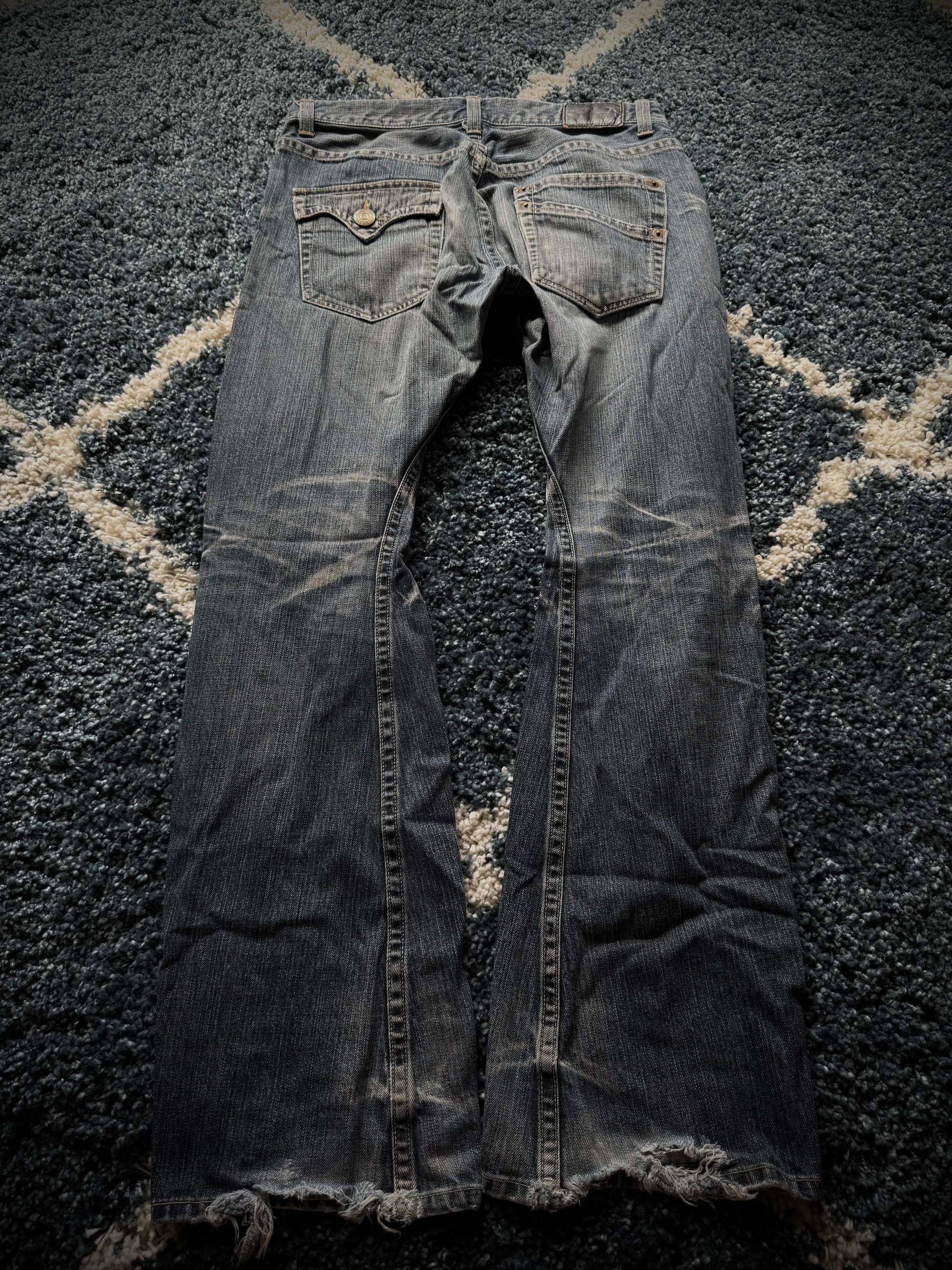 Rattle Trap frozen asymmetrical pocket flared jeans