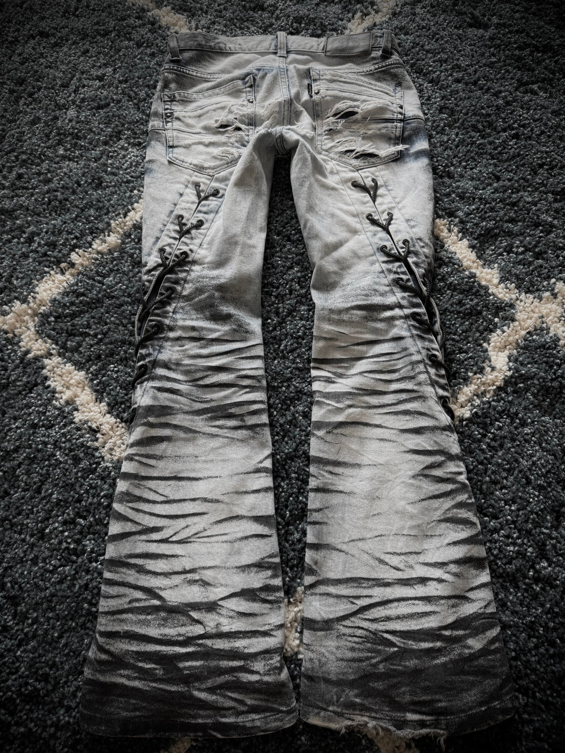 Tornado Mart Zebra laced up spiral flared jeans