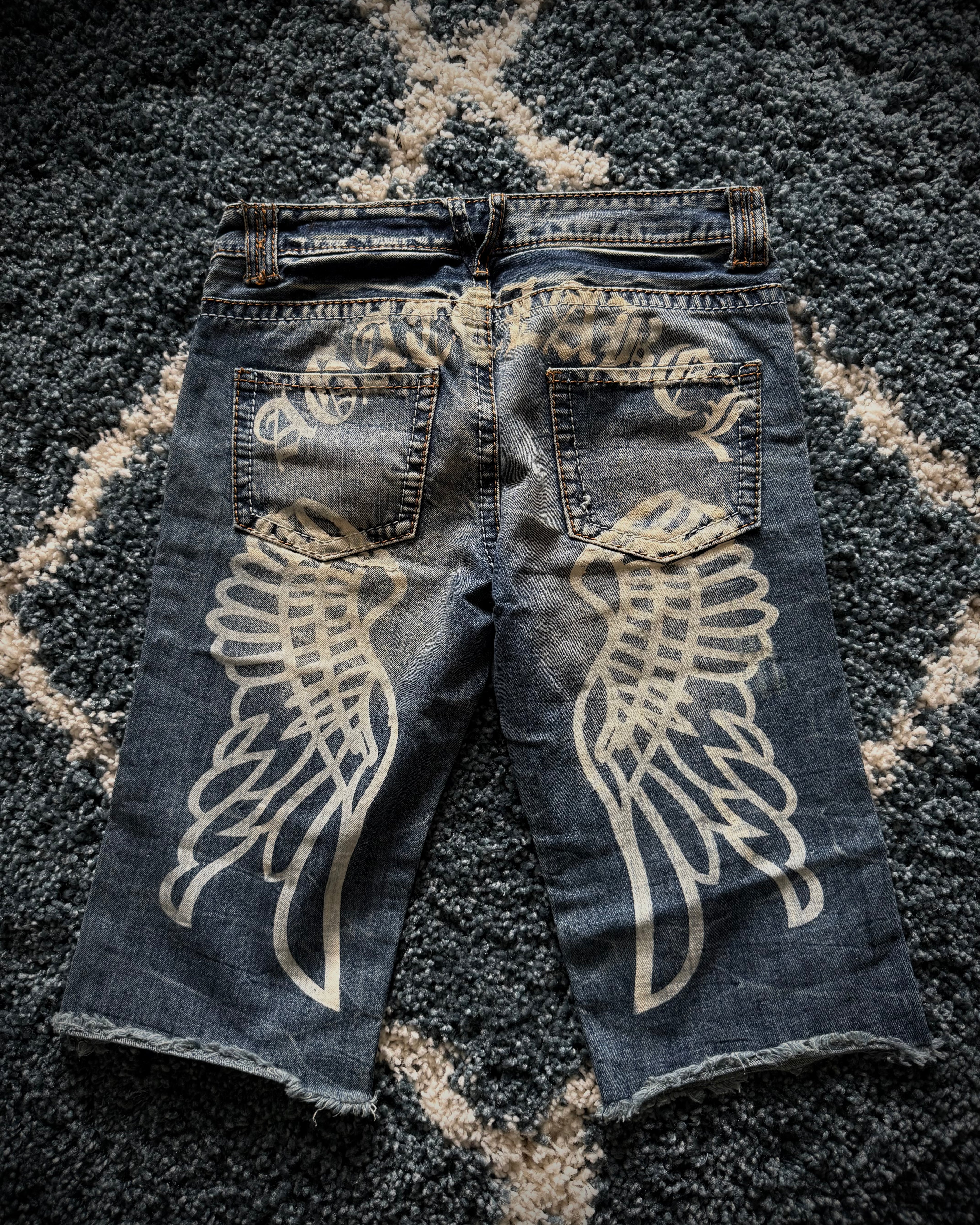 Agathe distressed wing shorts