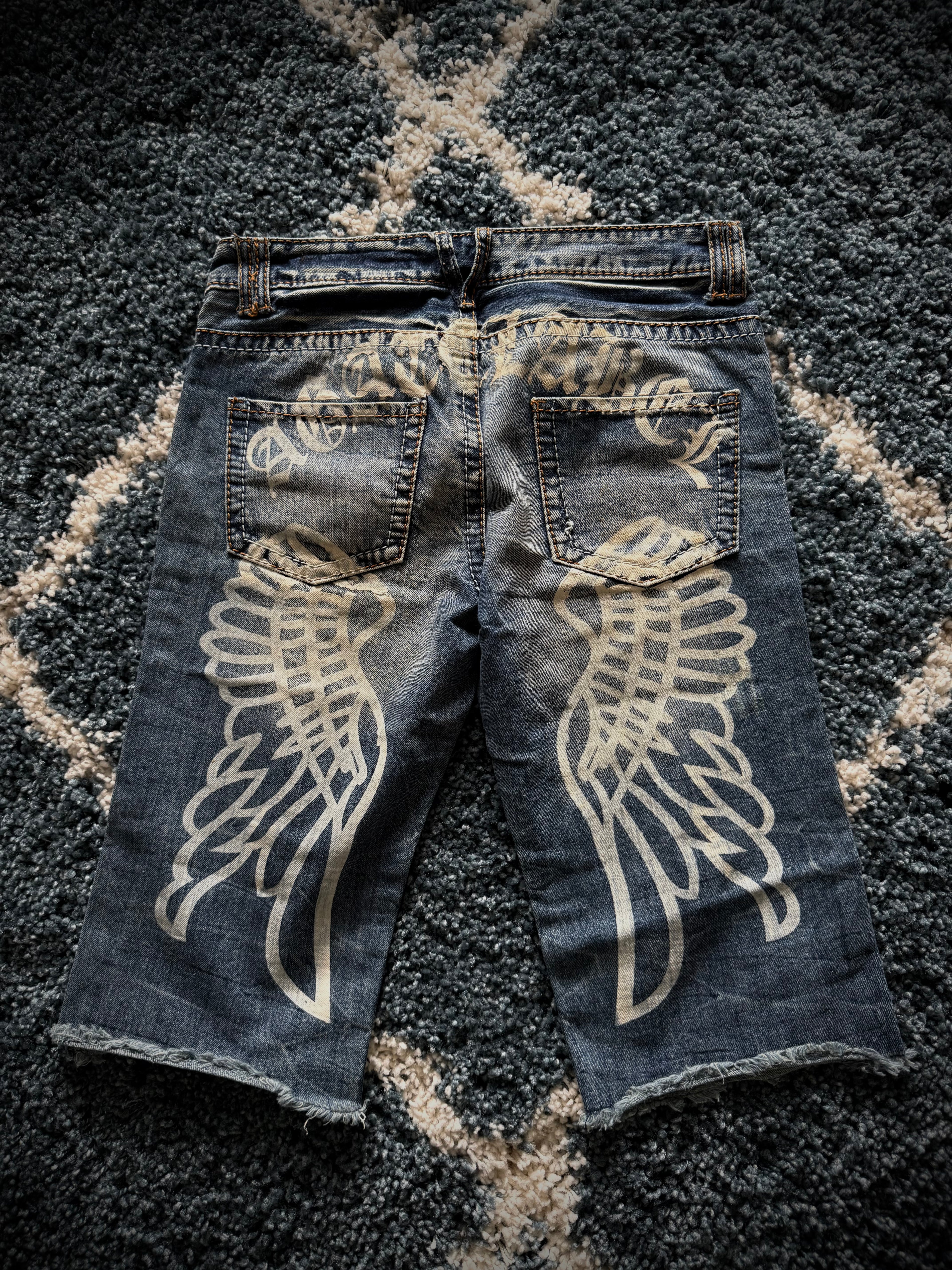 Agathe distressed wing shorts