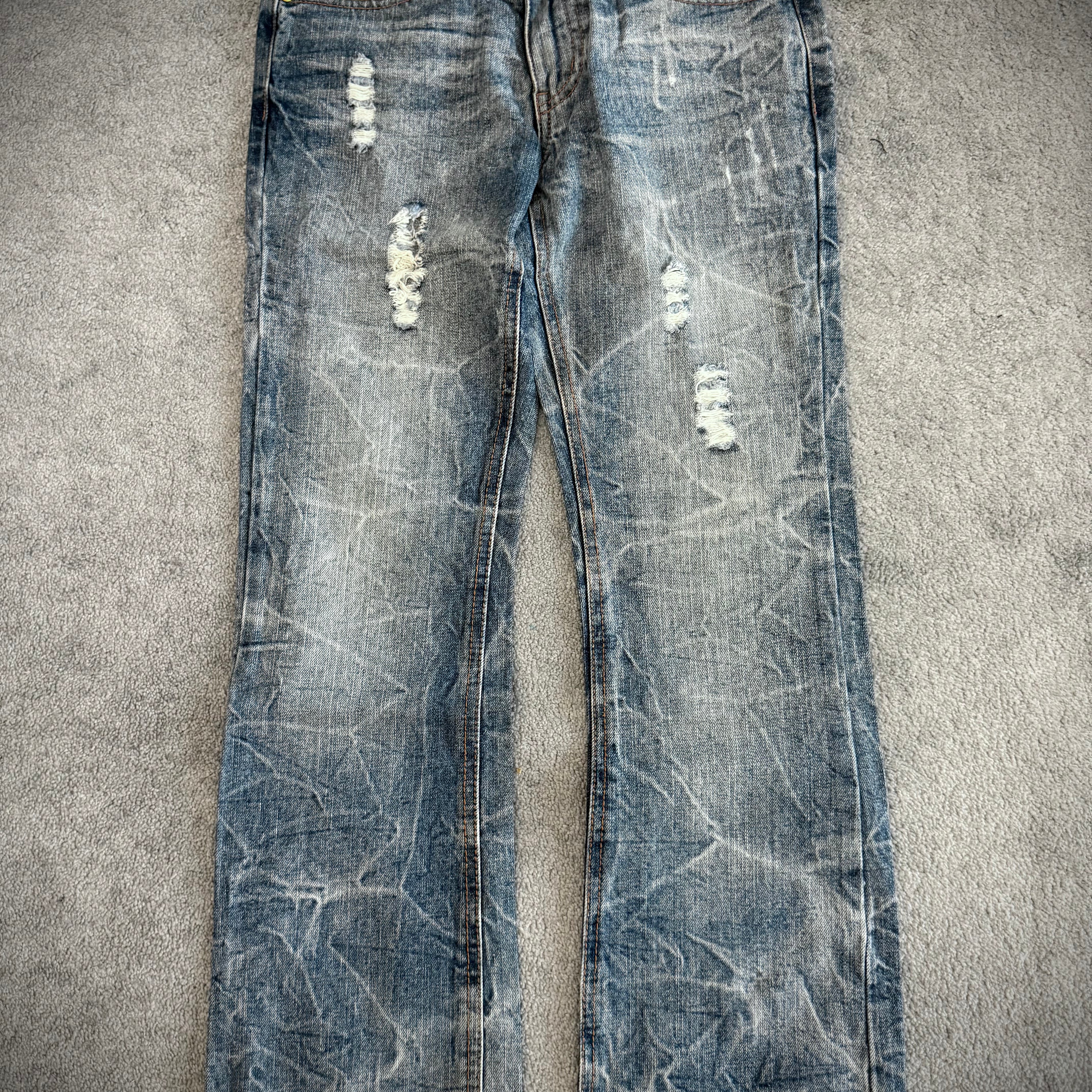 Lowbox distressed Clawmark flared denim