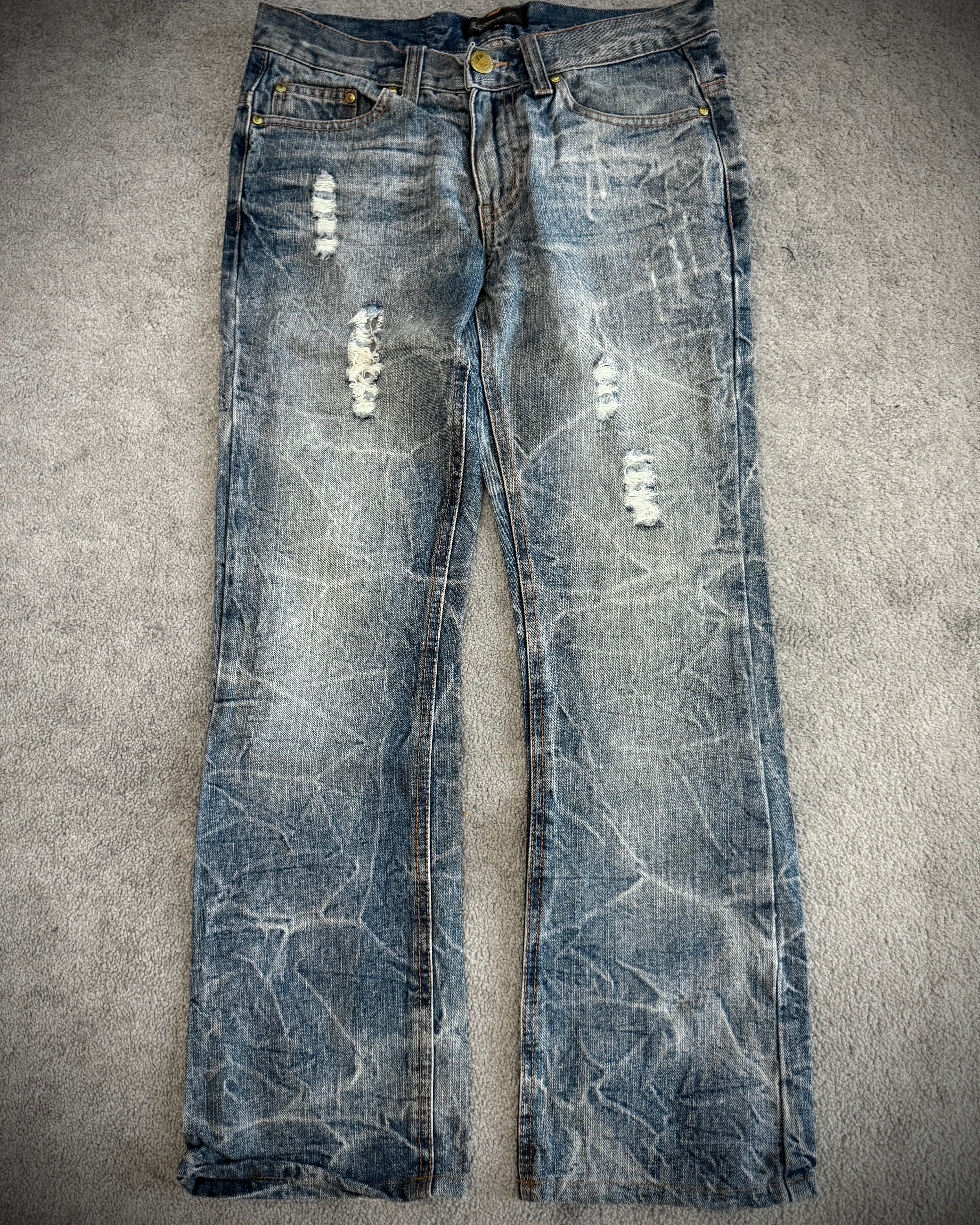 Lowbox distressed Clawmark flared denim