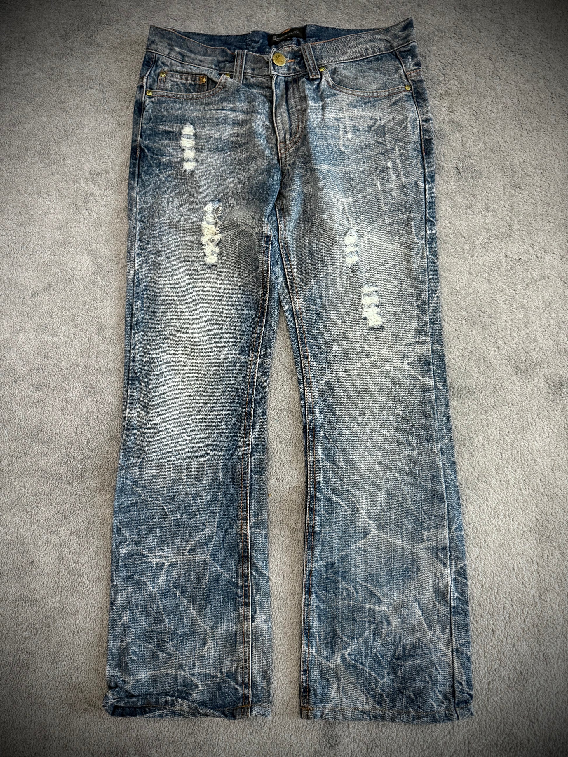 Lowbox distressed Clawmark flared denim