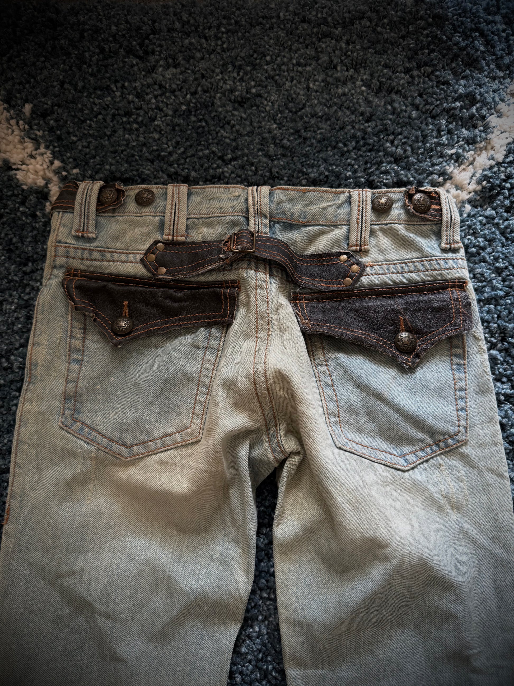 Kingsman leather detailed distressed flared denim