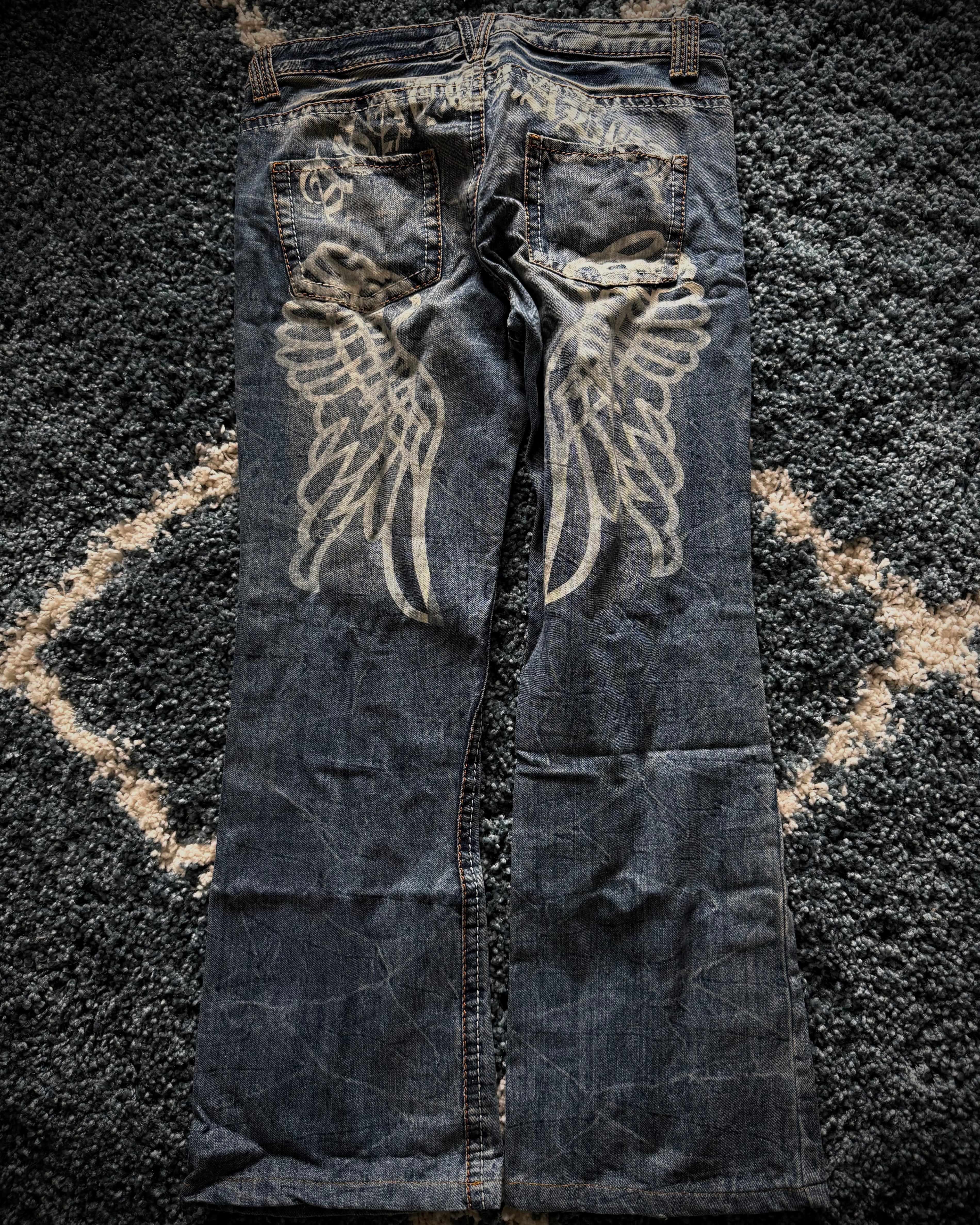 Agathe Wing Distressed honeycomb flared jeans