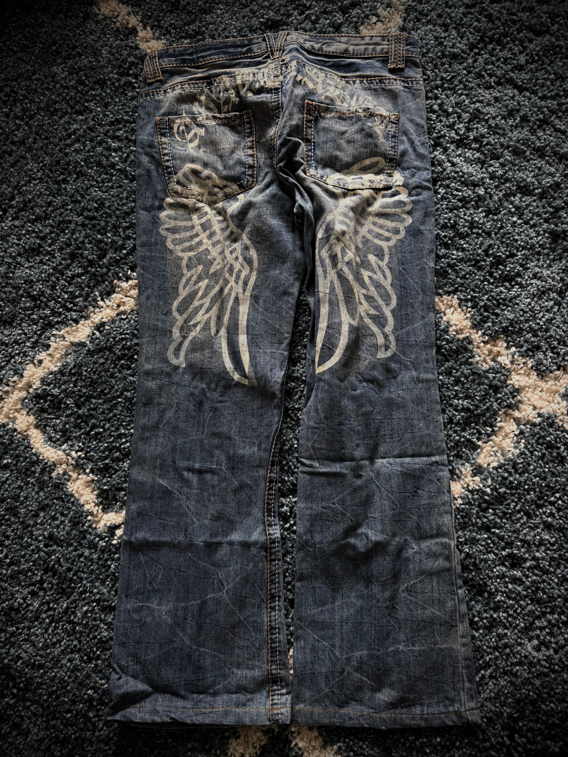 Agathe Wing Distressed honeycomb flared jeans