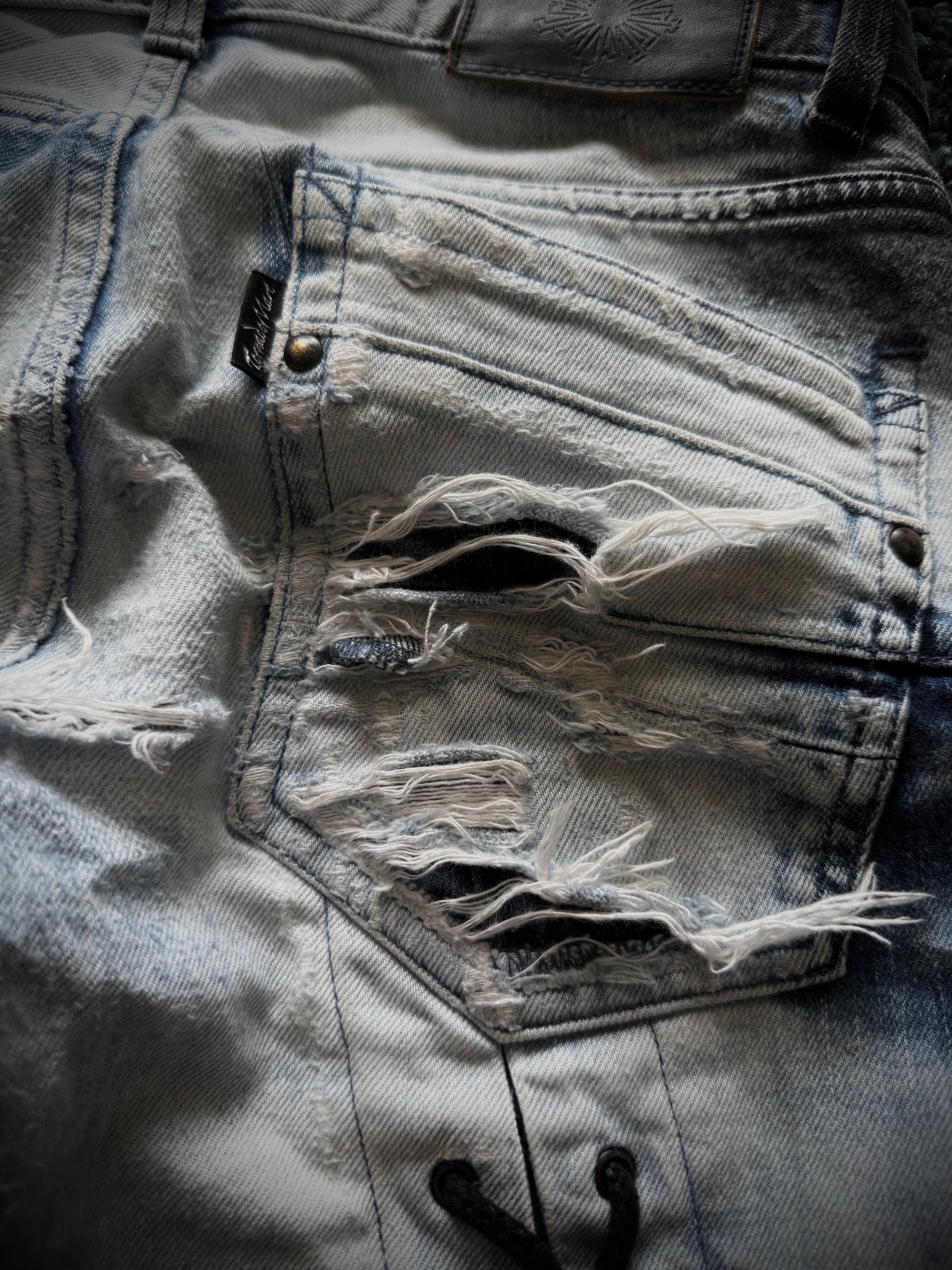 Tornado Mart Zebra laced up spiral flared jeans