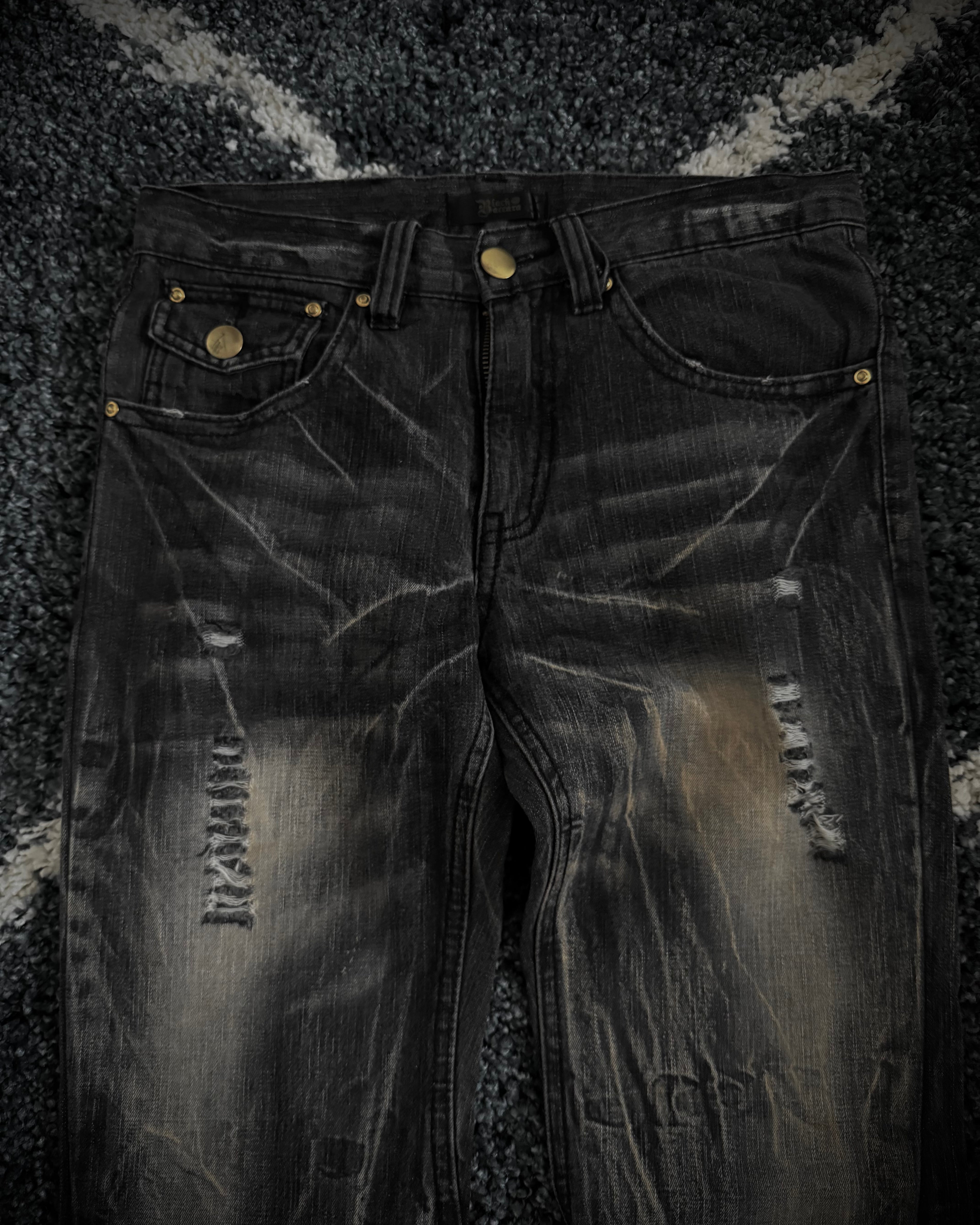 Black Baccara distressed flared denim