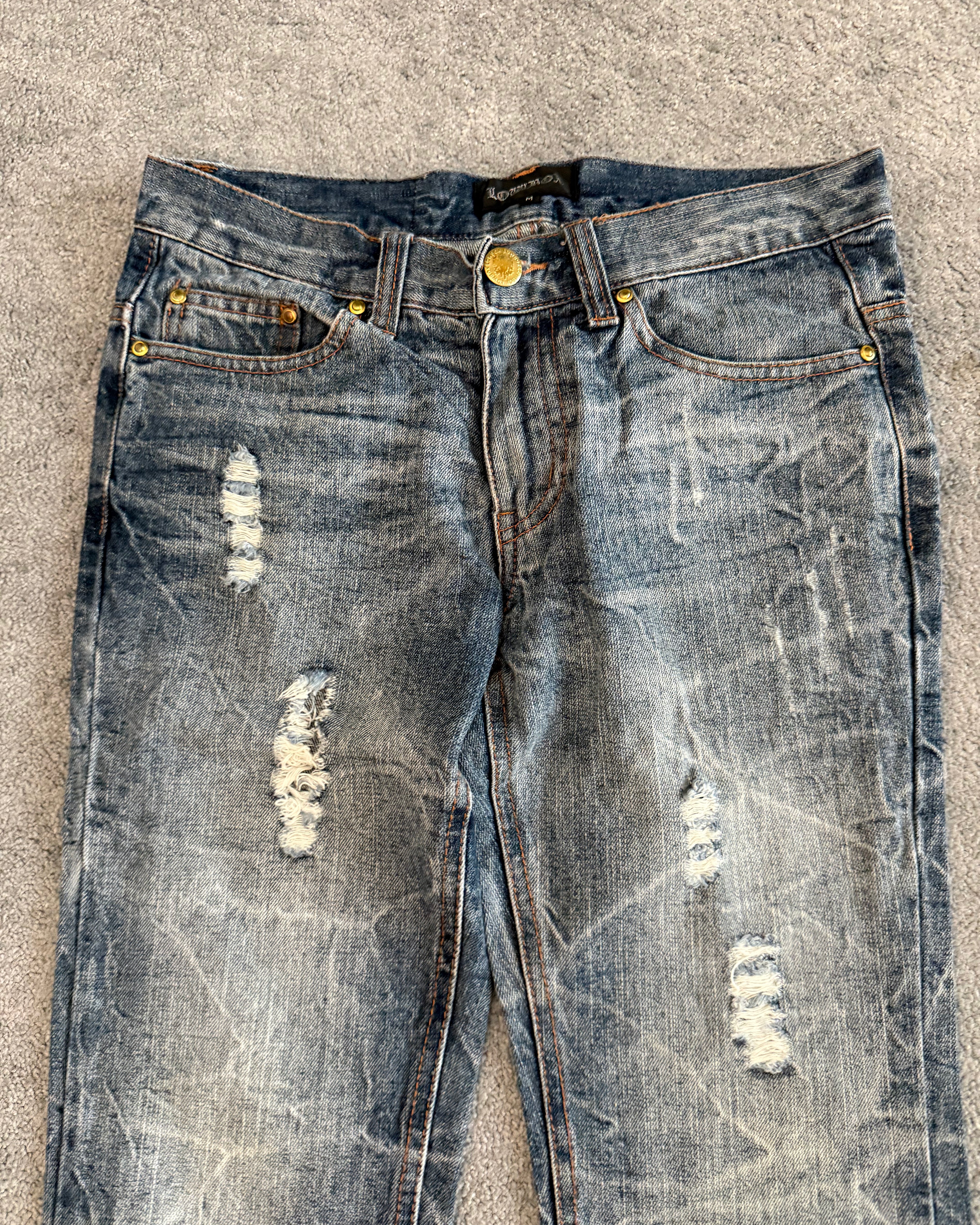 Lowbox distressed Clawmark flared denim