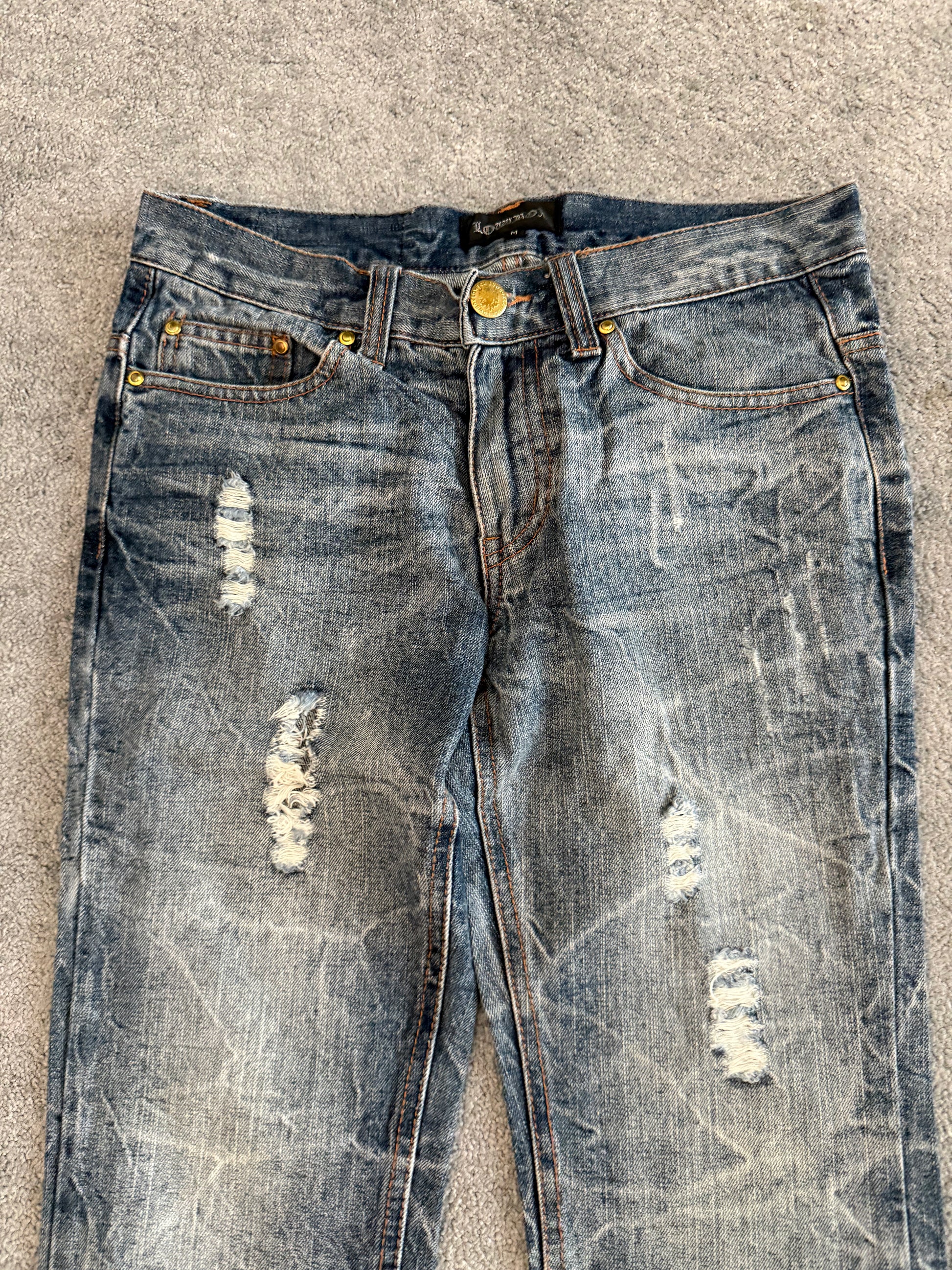 Lowbox distressed Clawmark flared denim