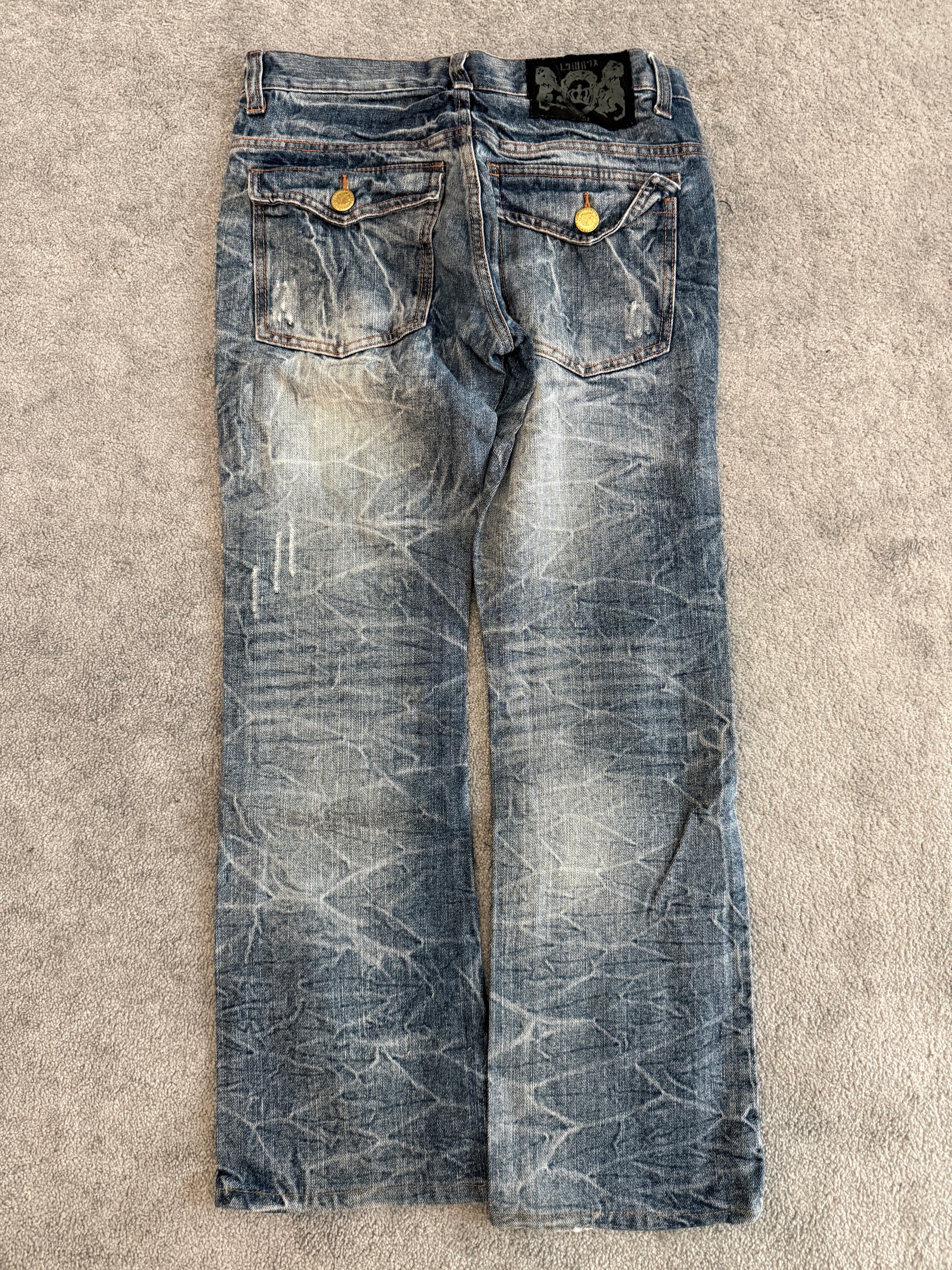 Lowbox distressed Clawmark flared denim