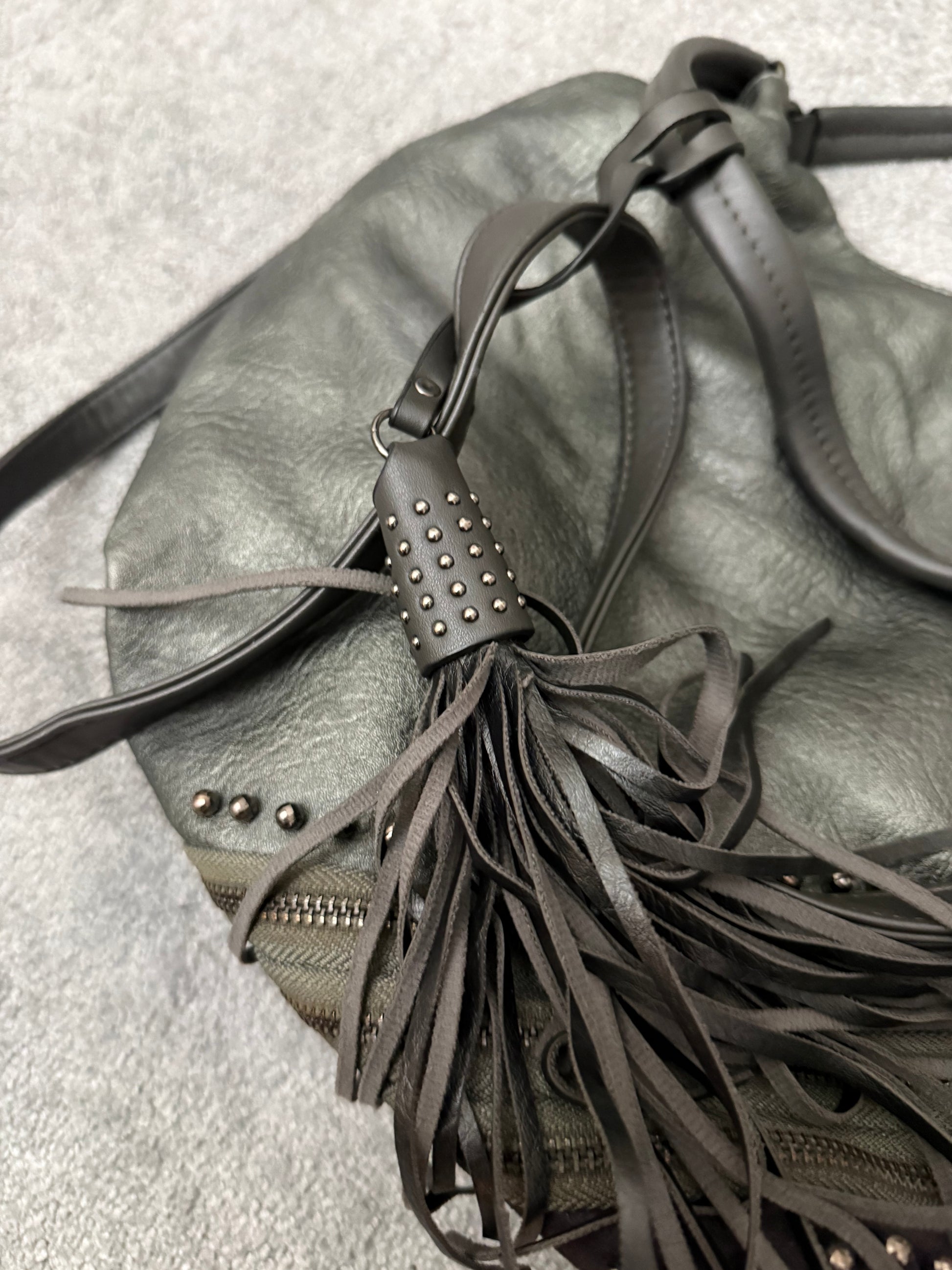 MUTANT tripple zipper studded tassels leather bag