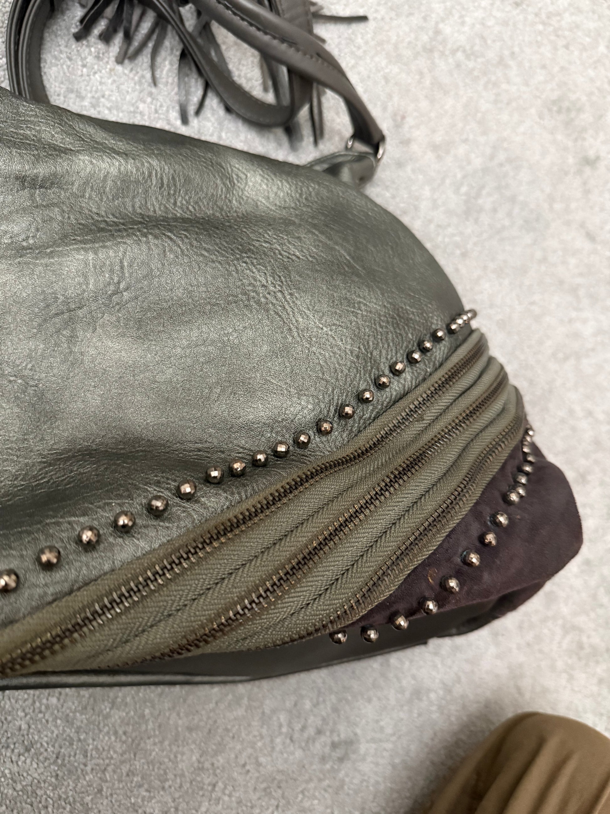 MUTANT tripple zipper studded tassels leather bag