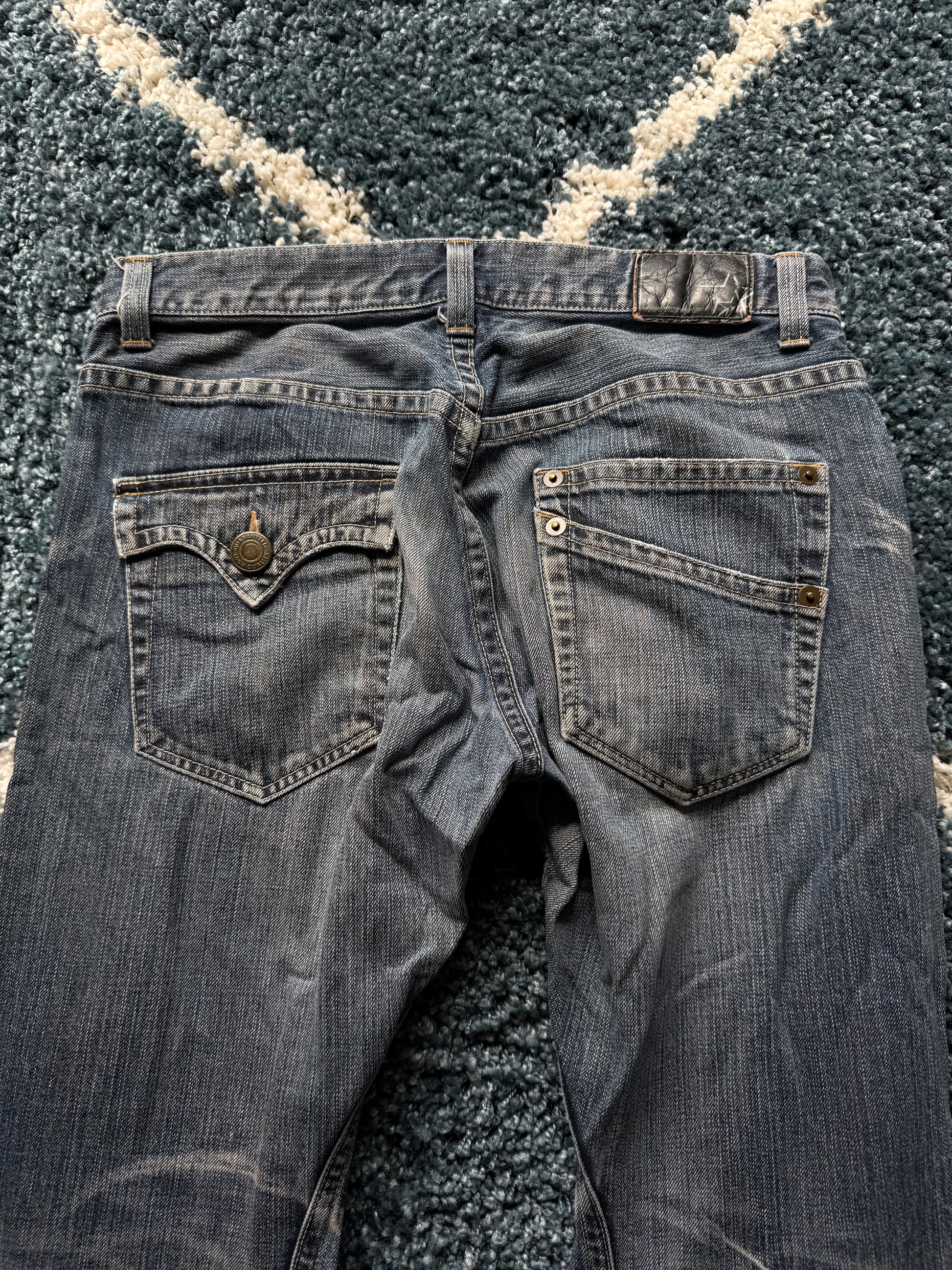 Rattle Trap frozen asymmetrical pocket flared jeans