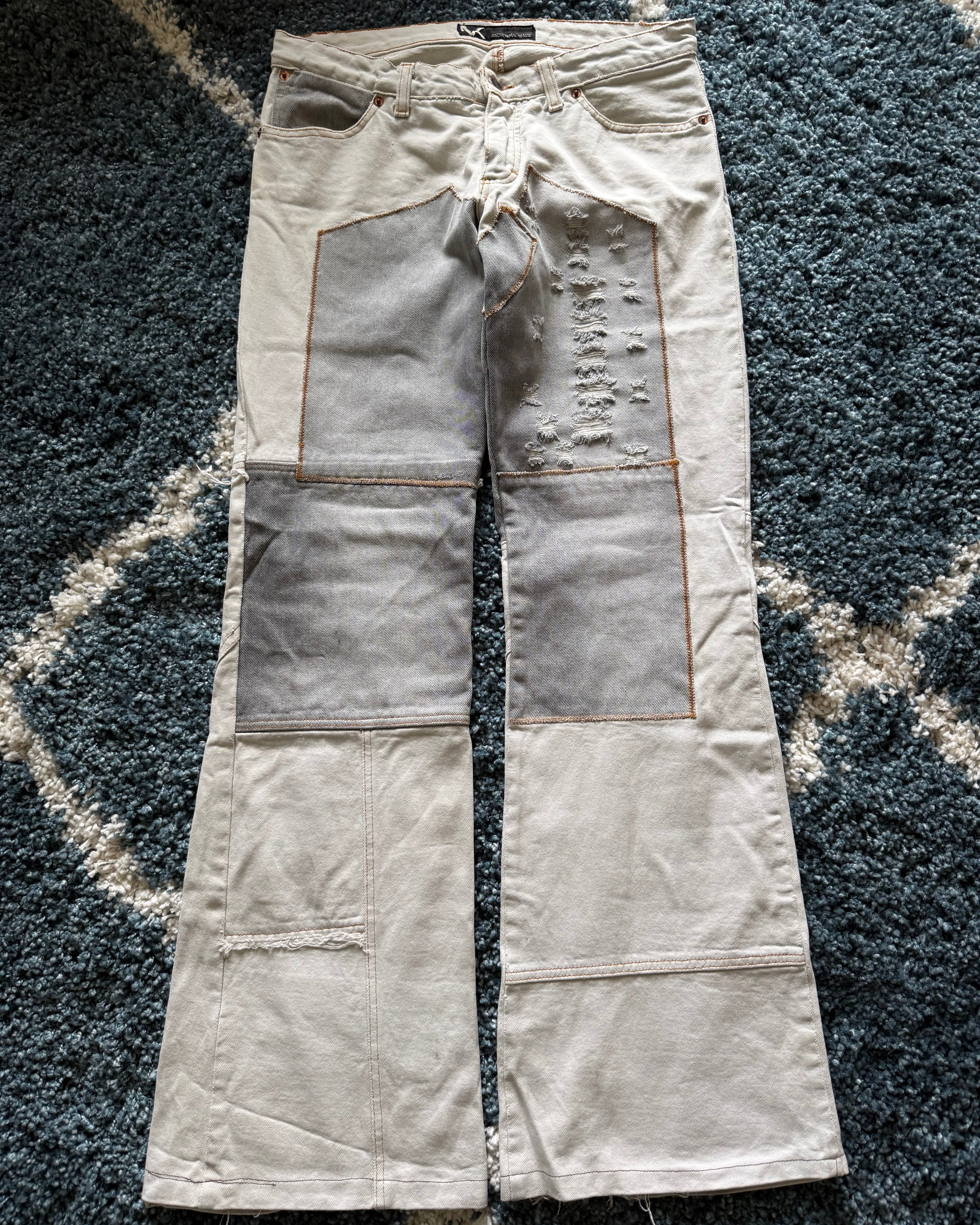 Andrew Mackenzie slashed sword knee blood pocket pants