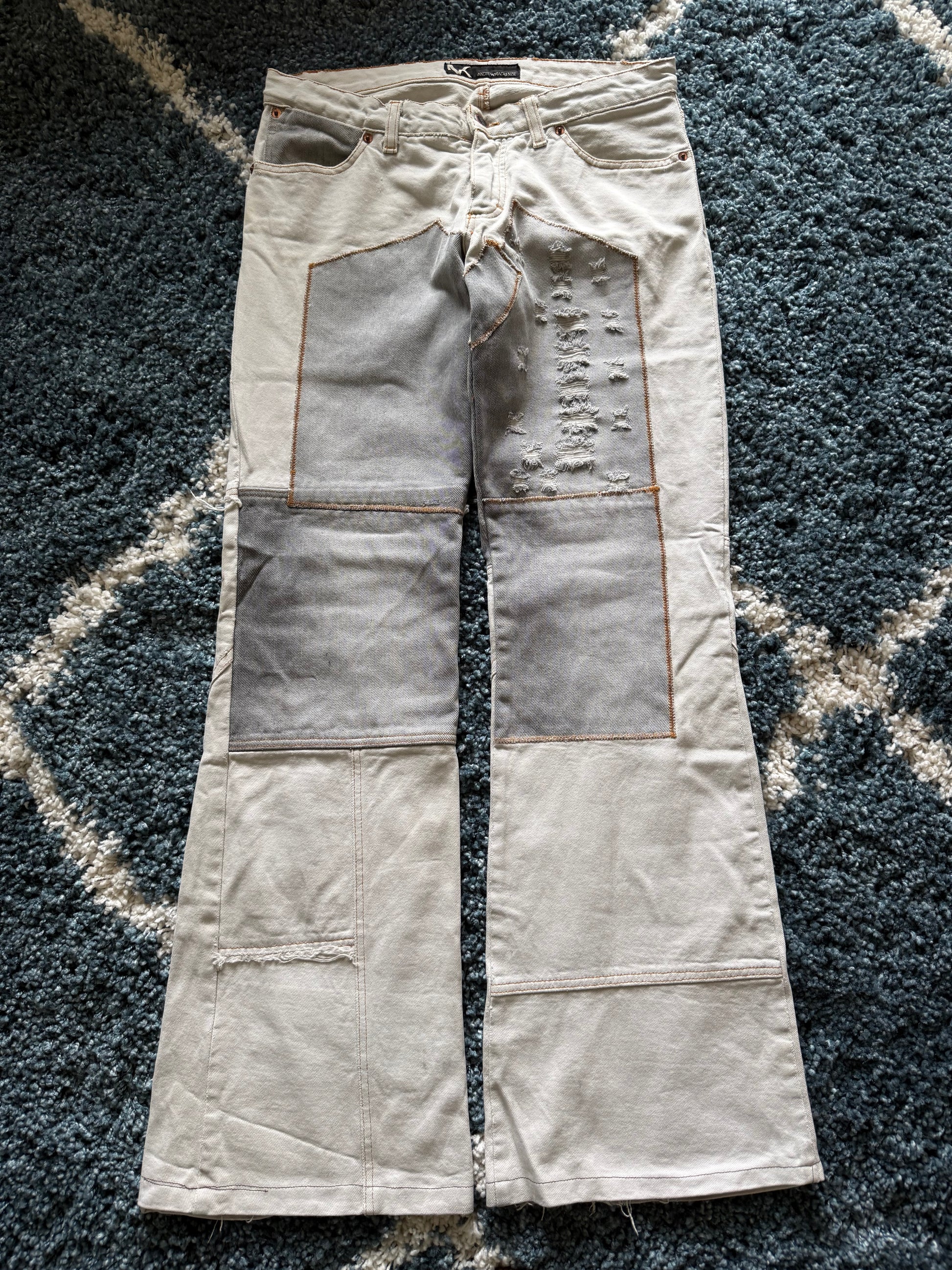 Andrew Mackenzie slashed sword knee blood pocket pants