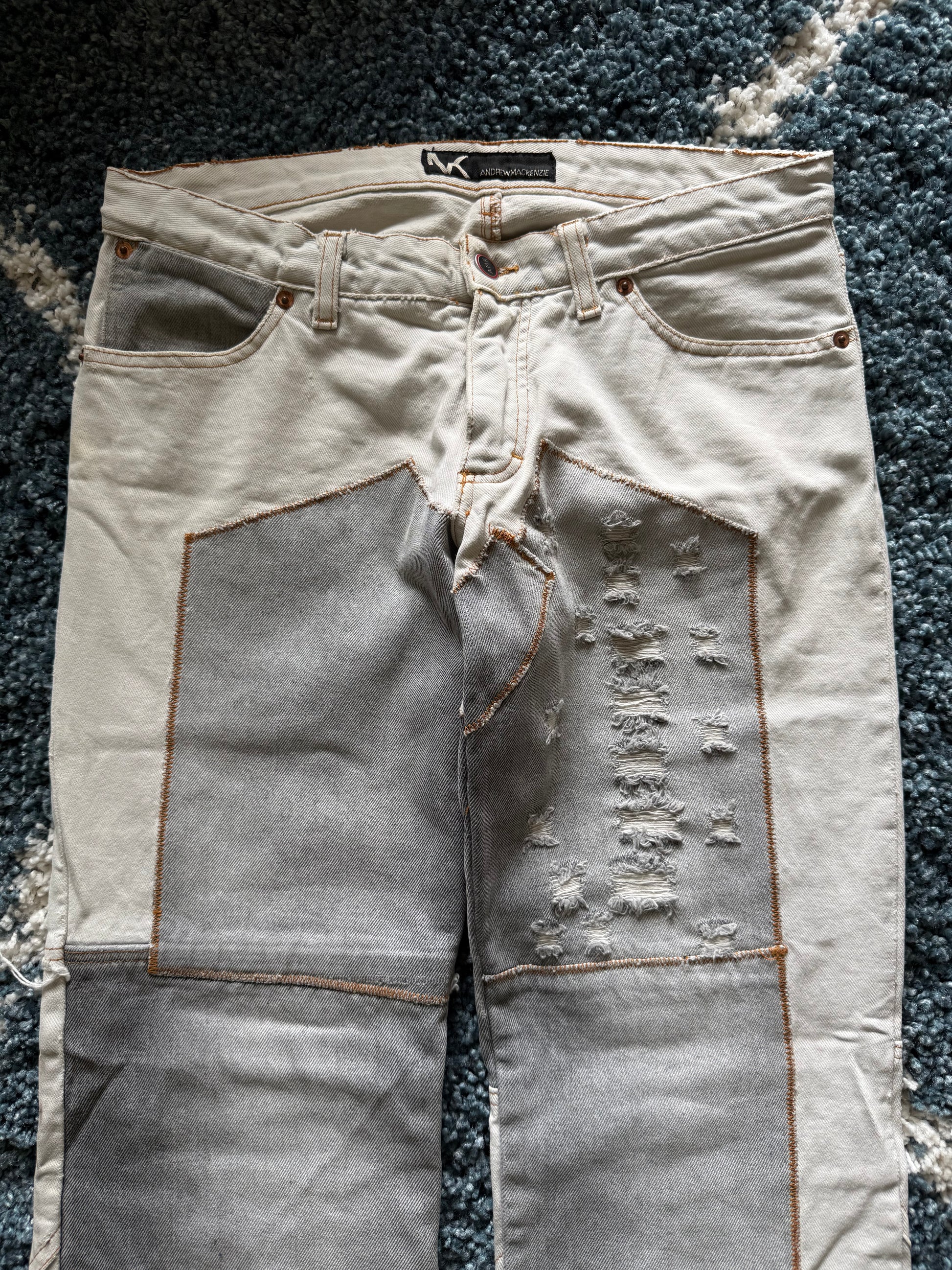 Andrew Mackenzie slashed sword knee blood pocket pants