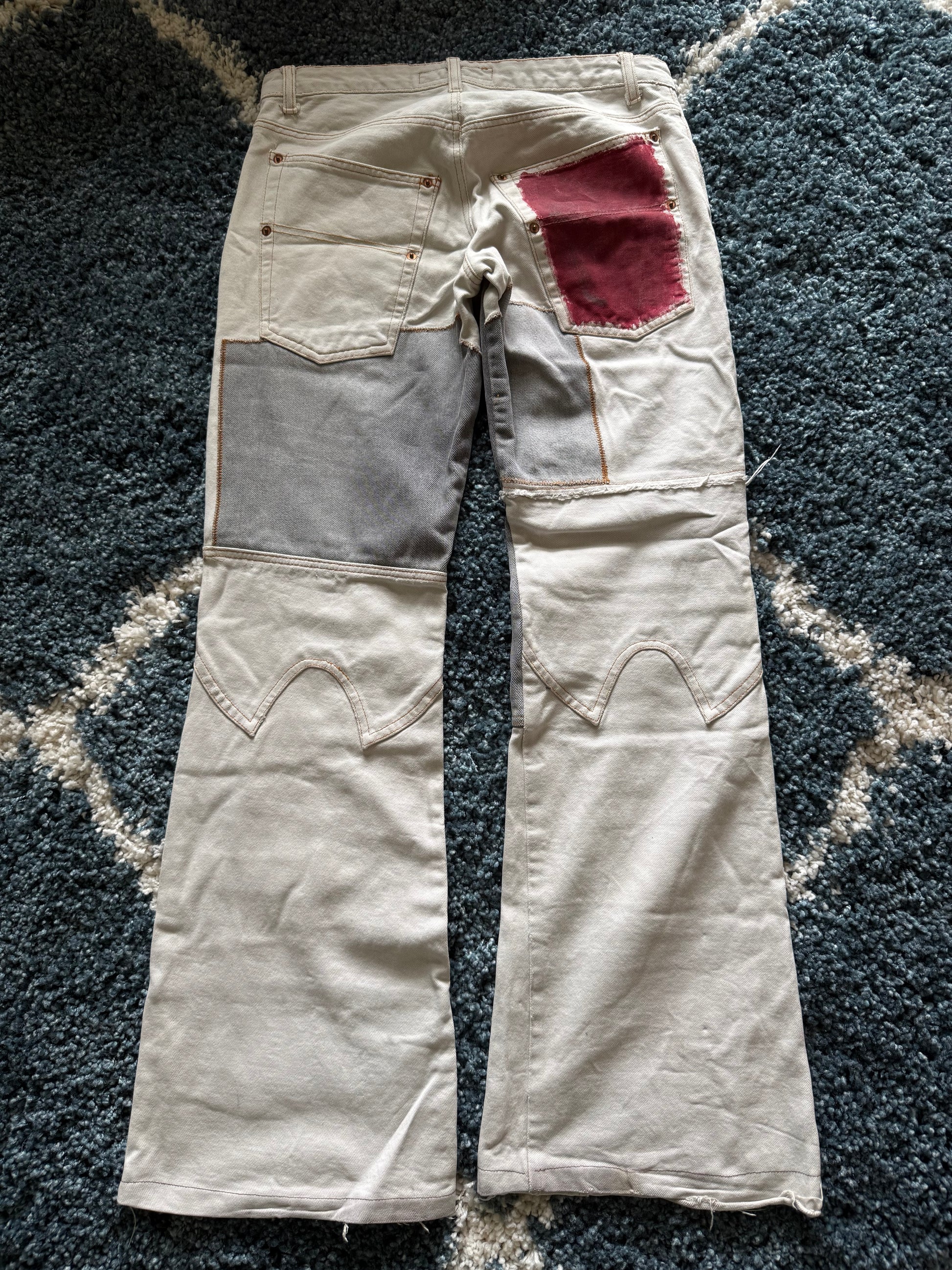 Andrew Mackenzie slashed sword knee blood pocket pants