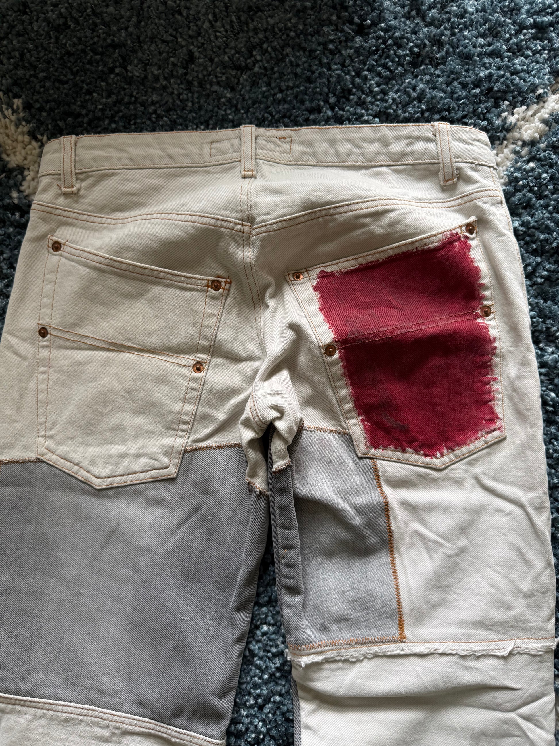 Andrew Mackenzie slashed sword knee blood pocket pants