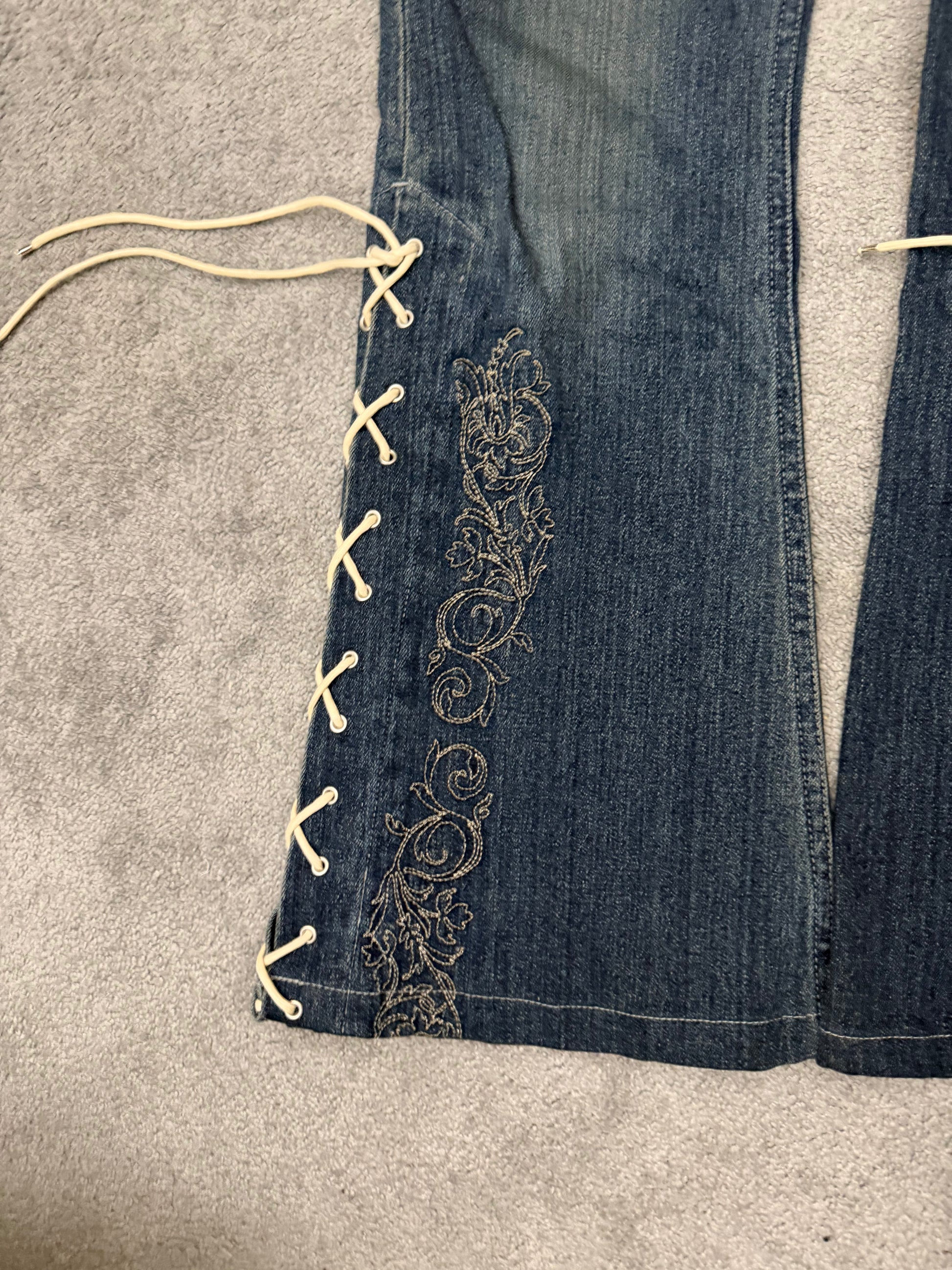 Tornado Mart Laced Up Tribal Flared Denim Pants