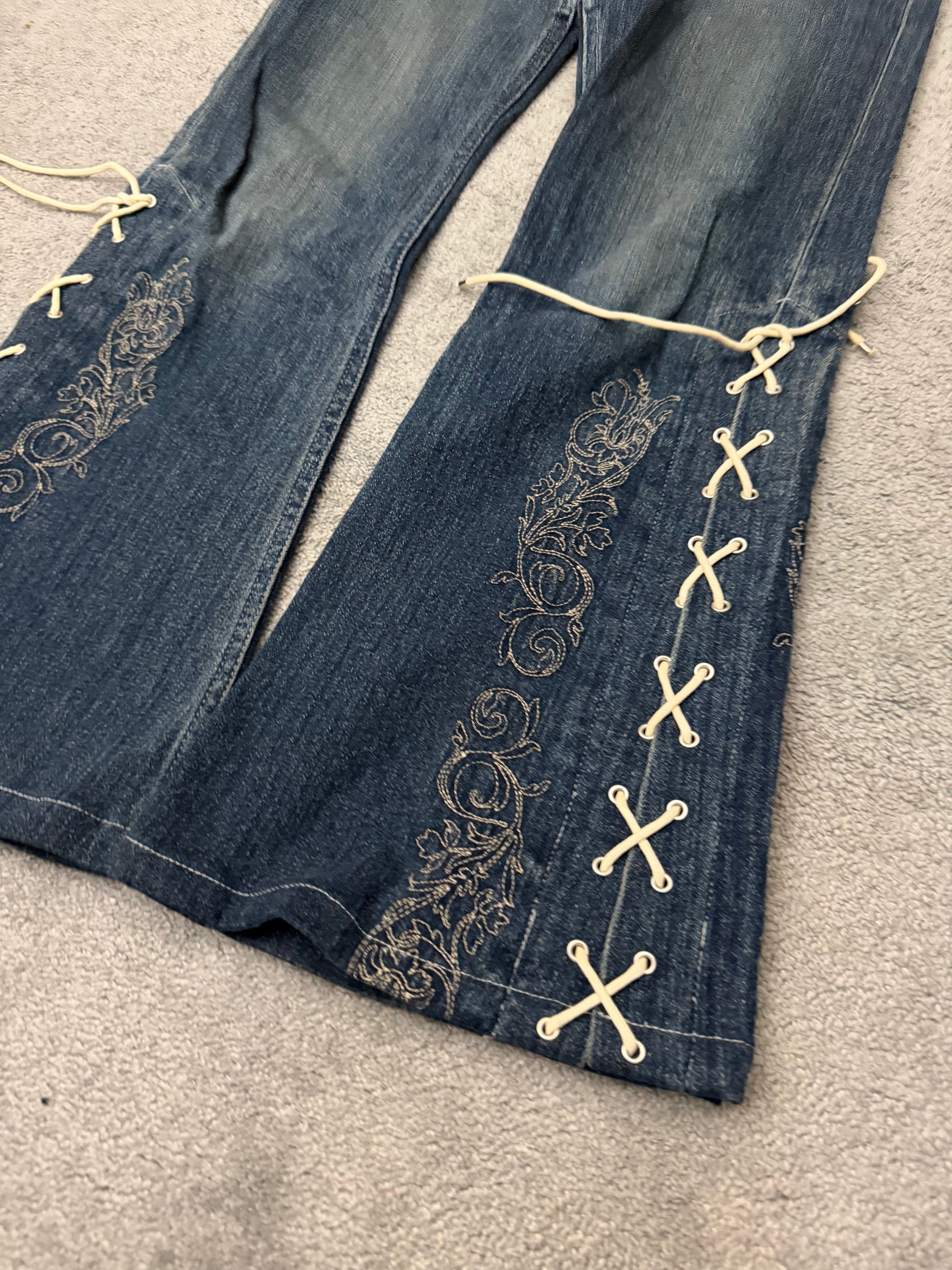 Tornado Mart Laced Up Tribal Flared Denim Pants