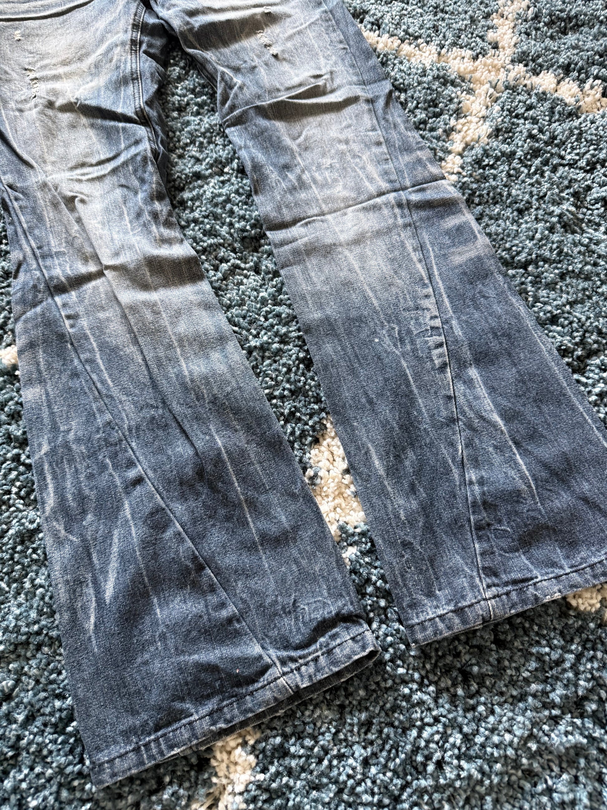 Black Baccara spiral distressed flared denim