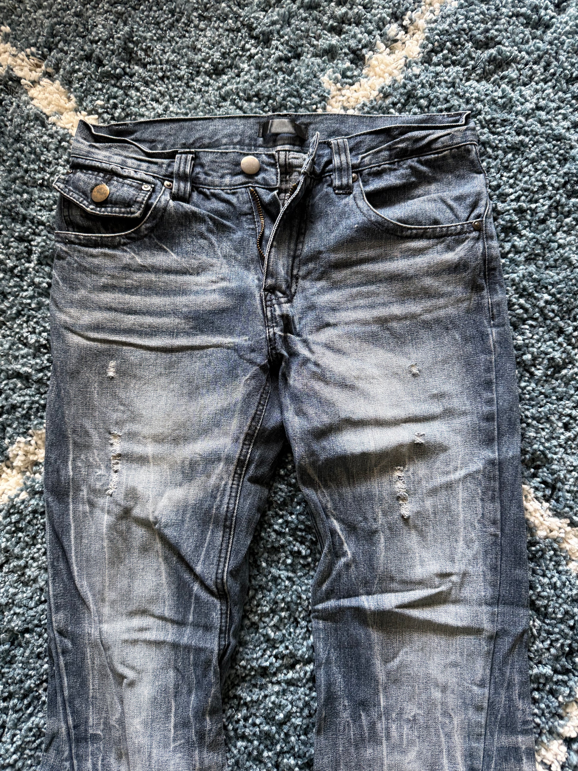 Black Baccara spiral distressed flared denim