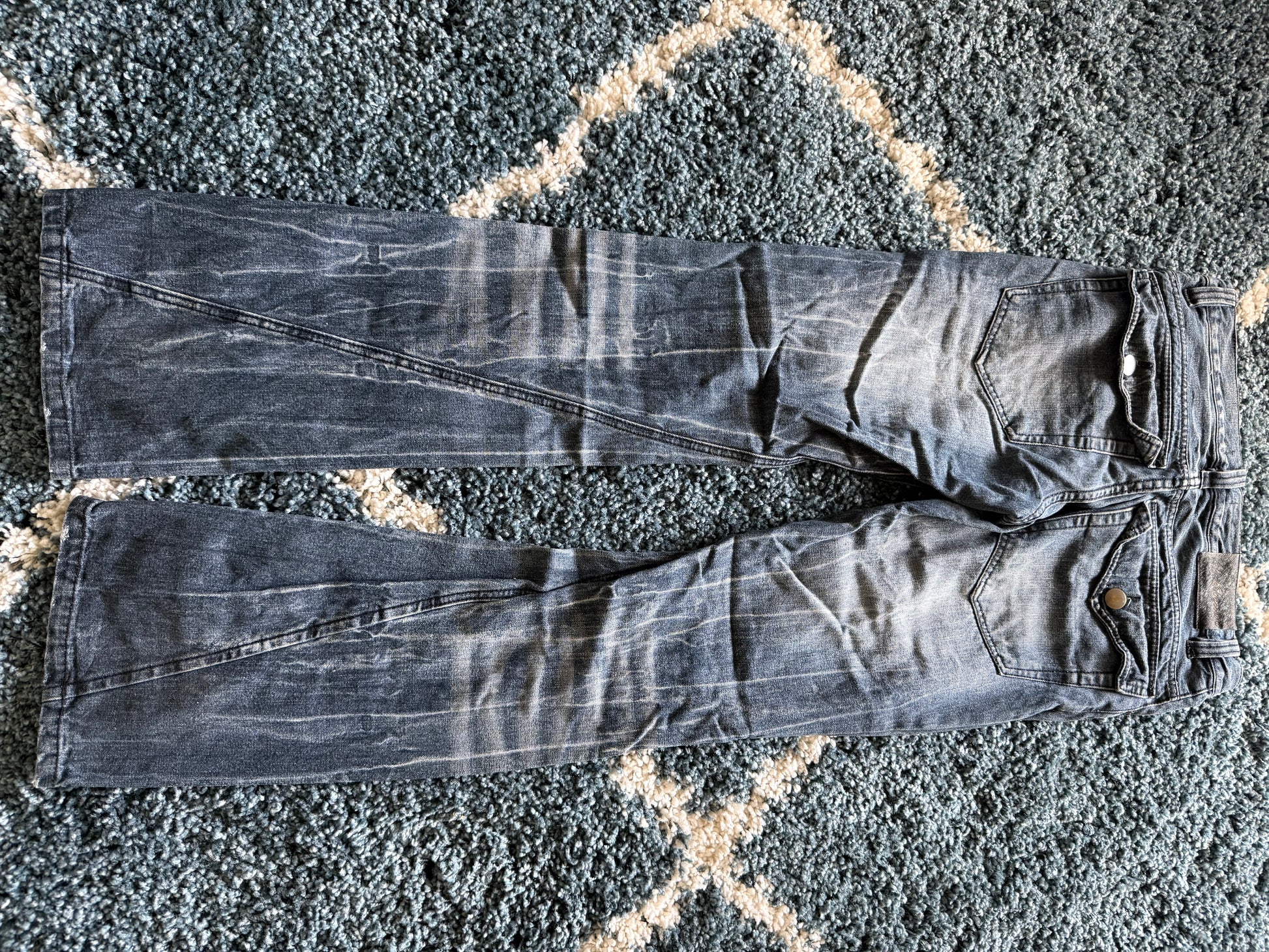 Black Baccara spiral distressed flared denim