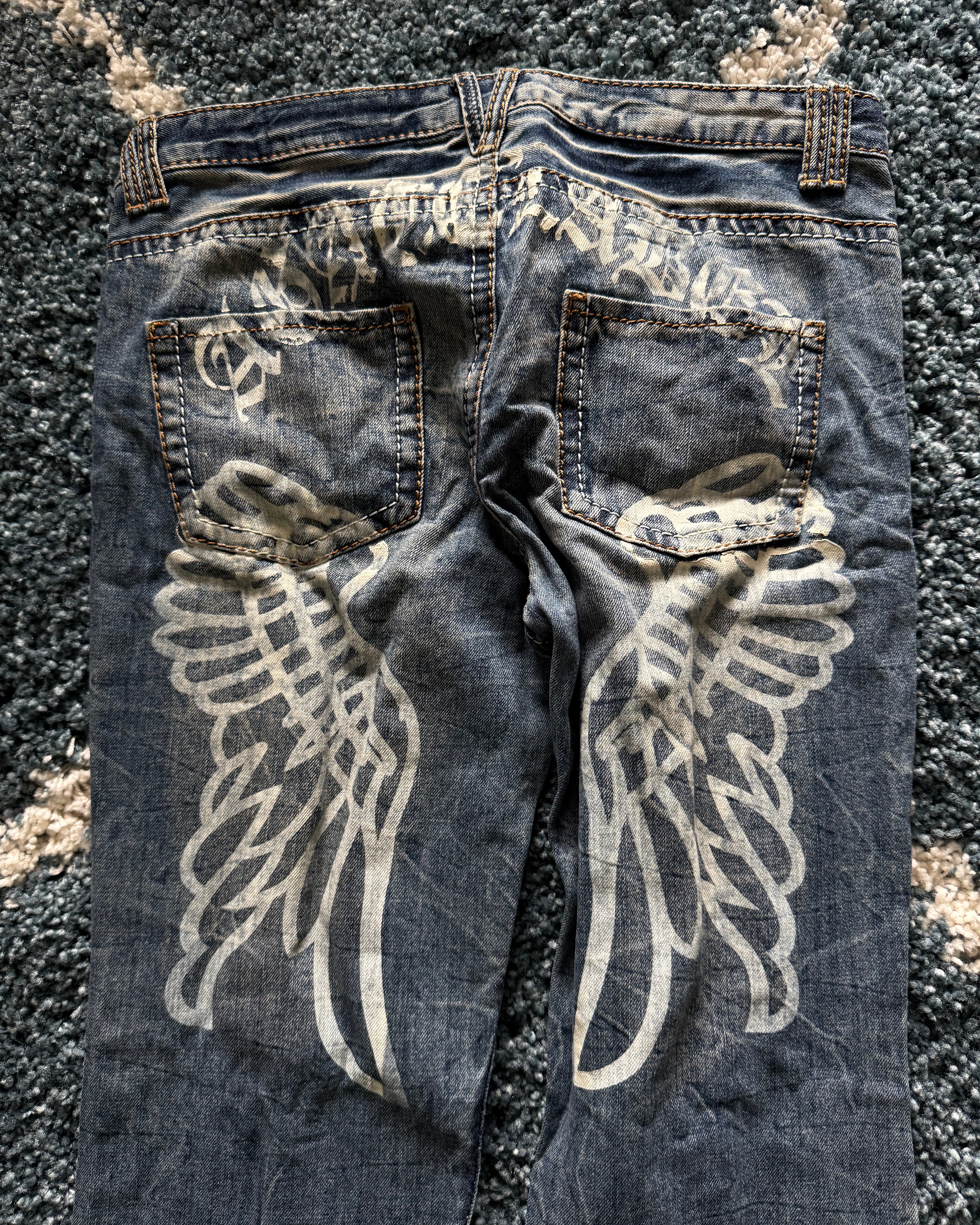 Agathe Wing Distressed honeycomb flared jeans