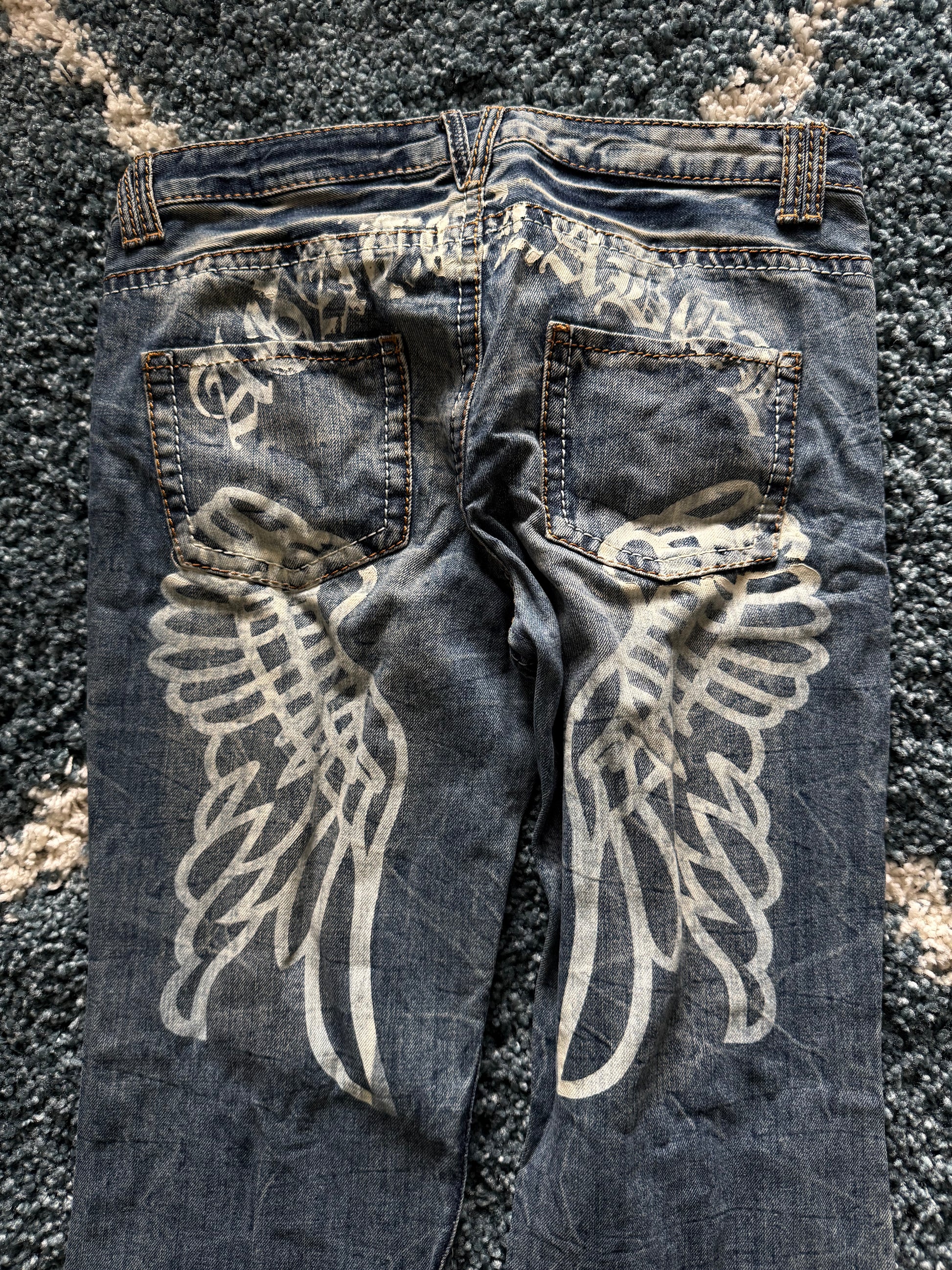 Agathe Wing Distressed honeycomb flared jeans