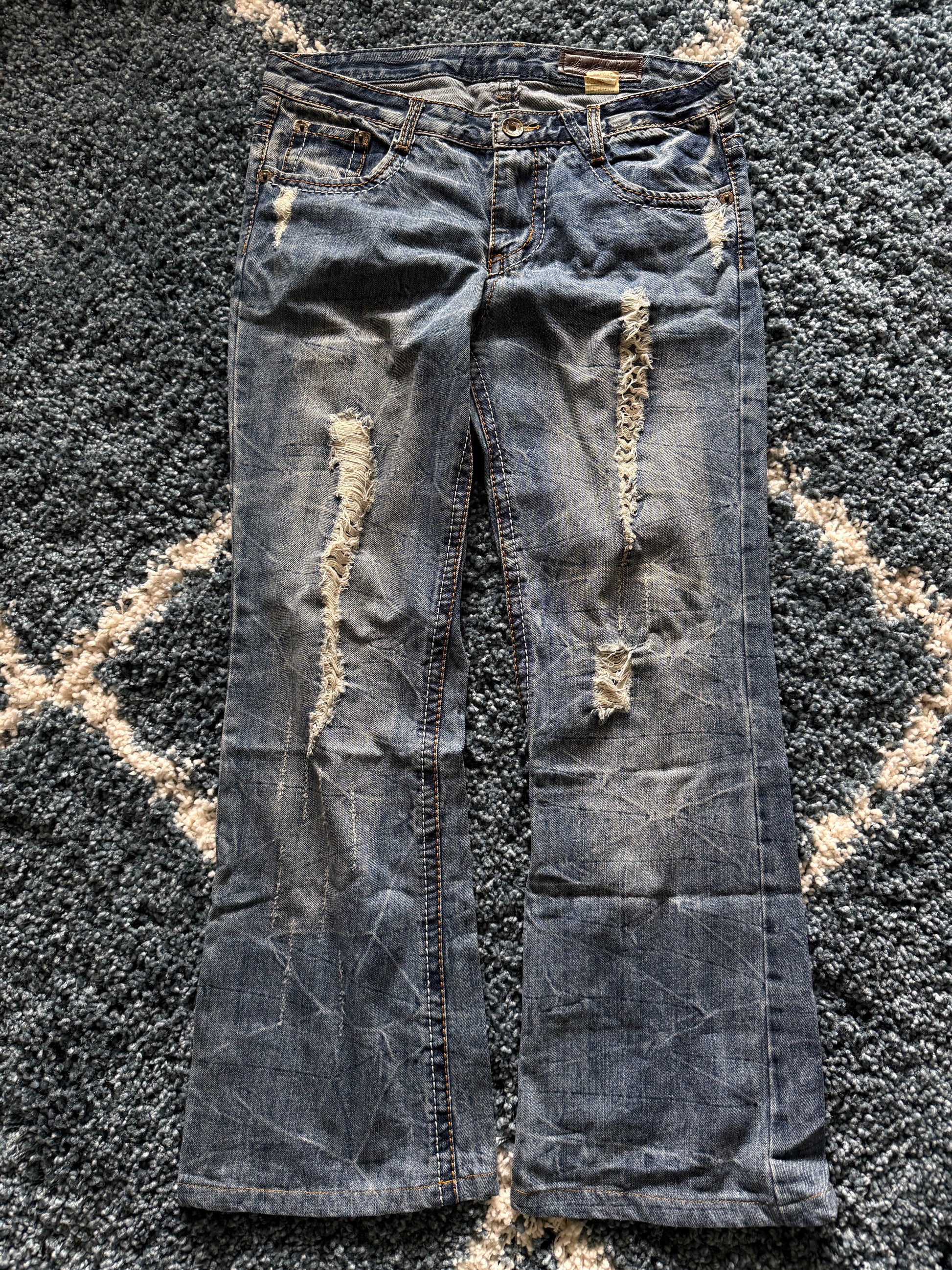 Agathe Wing Distressed honeycomb flared jeans
