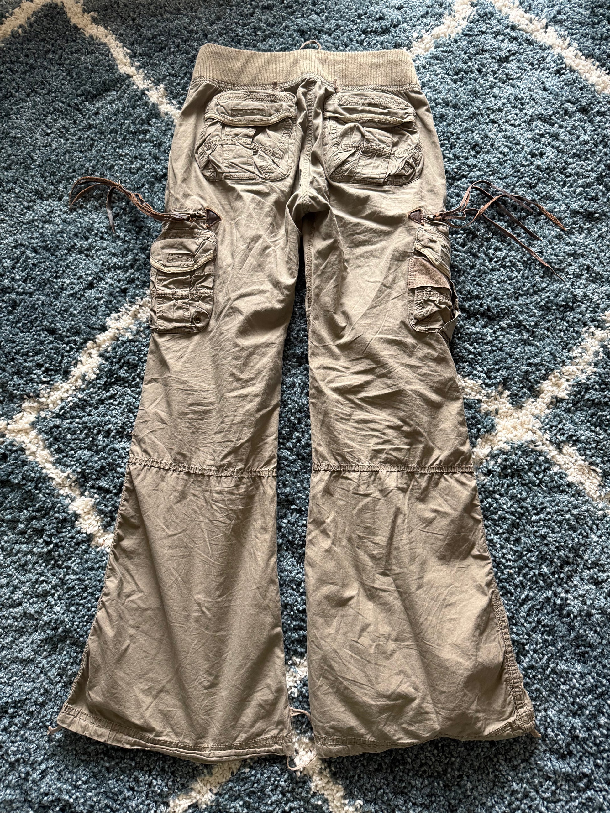 G.O.A leather tasseled mega flared military cargo pants