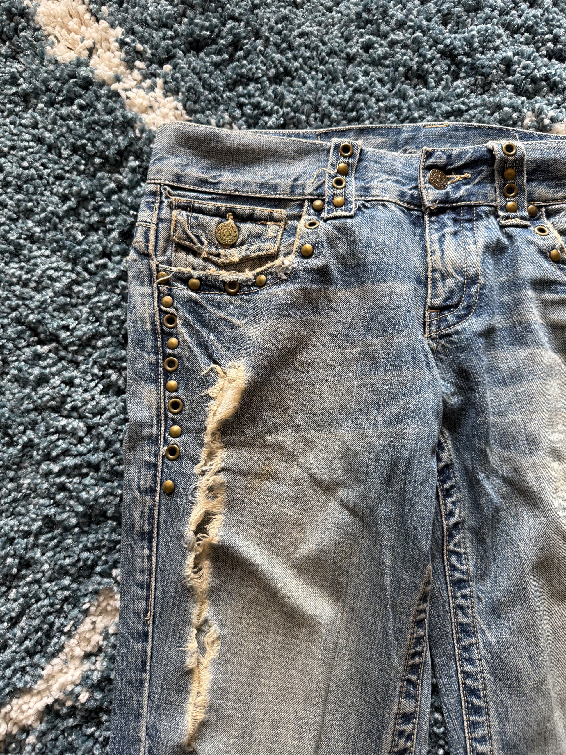 Tornado Mart spiral distressed studded flared denim