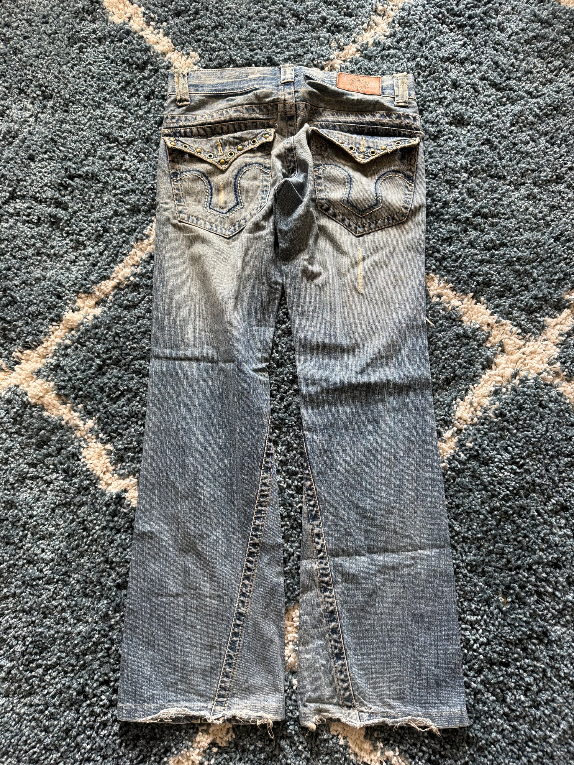 Tornado Mart spiral distressed studded flared denim