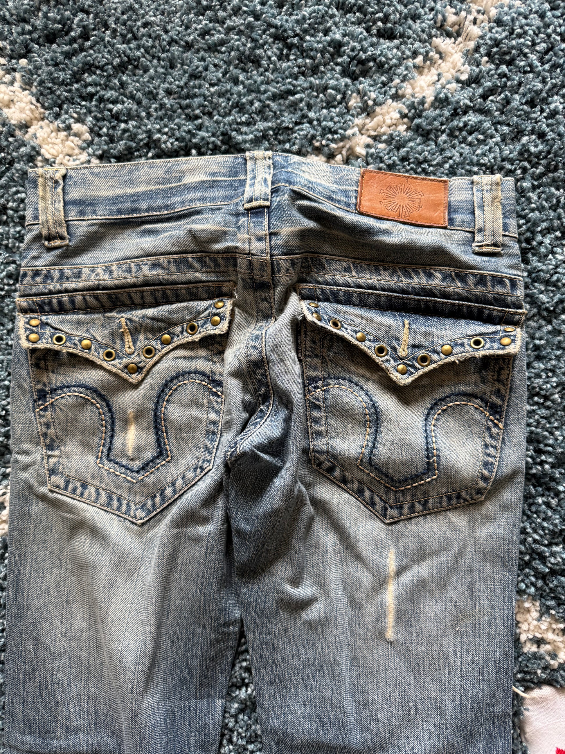 Tornado Mart spiral distressed studded flared denim