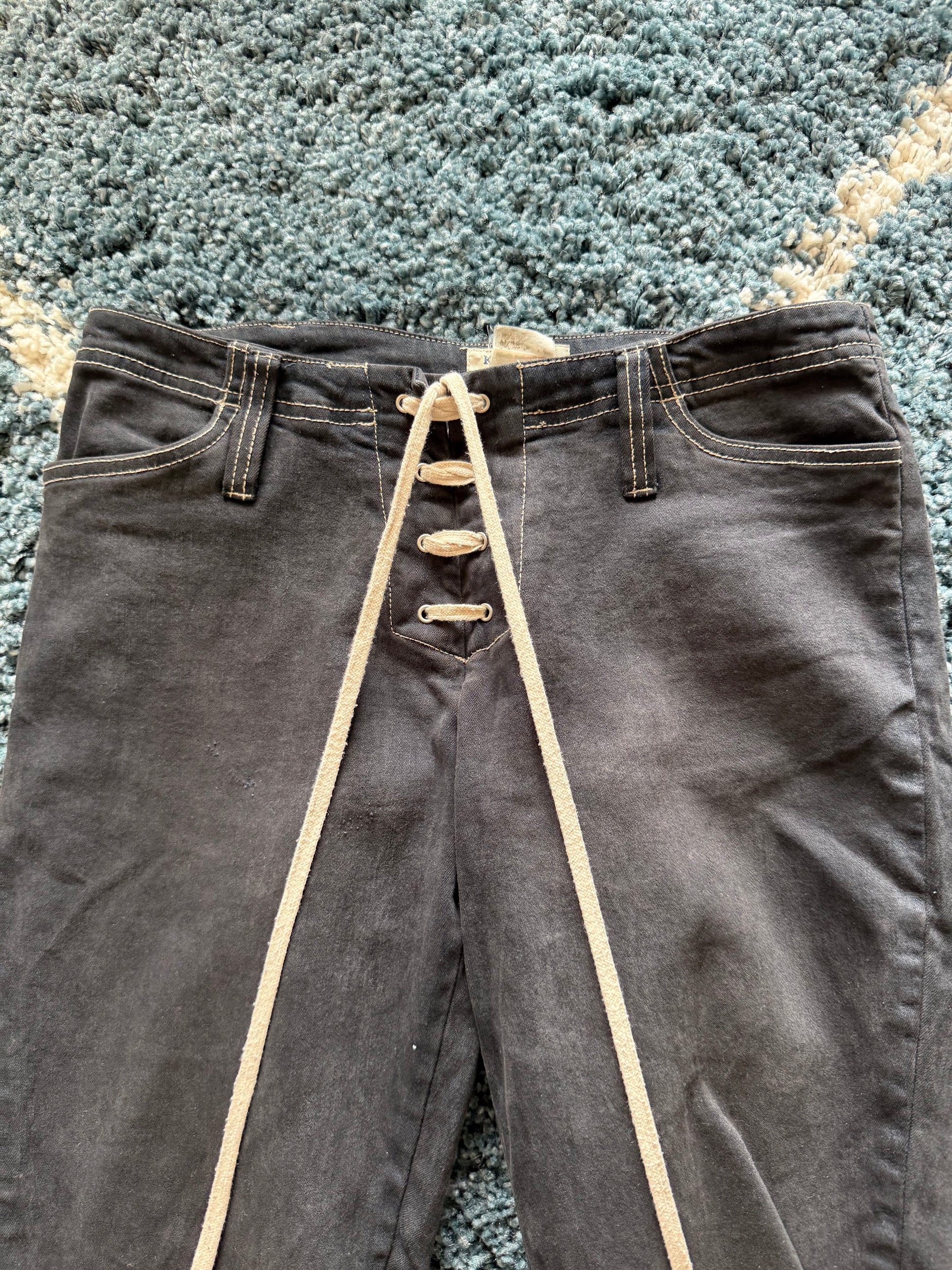 KIE Laced up leather pockets flared jeans